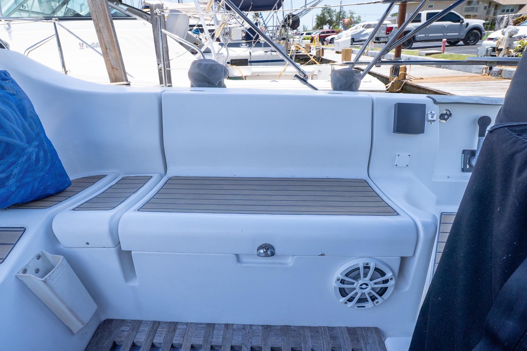 Cockpit seating area of a 1993 Beneteau First 38 s5 sailboat with teak accents.