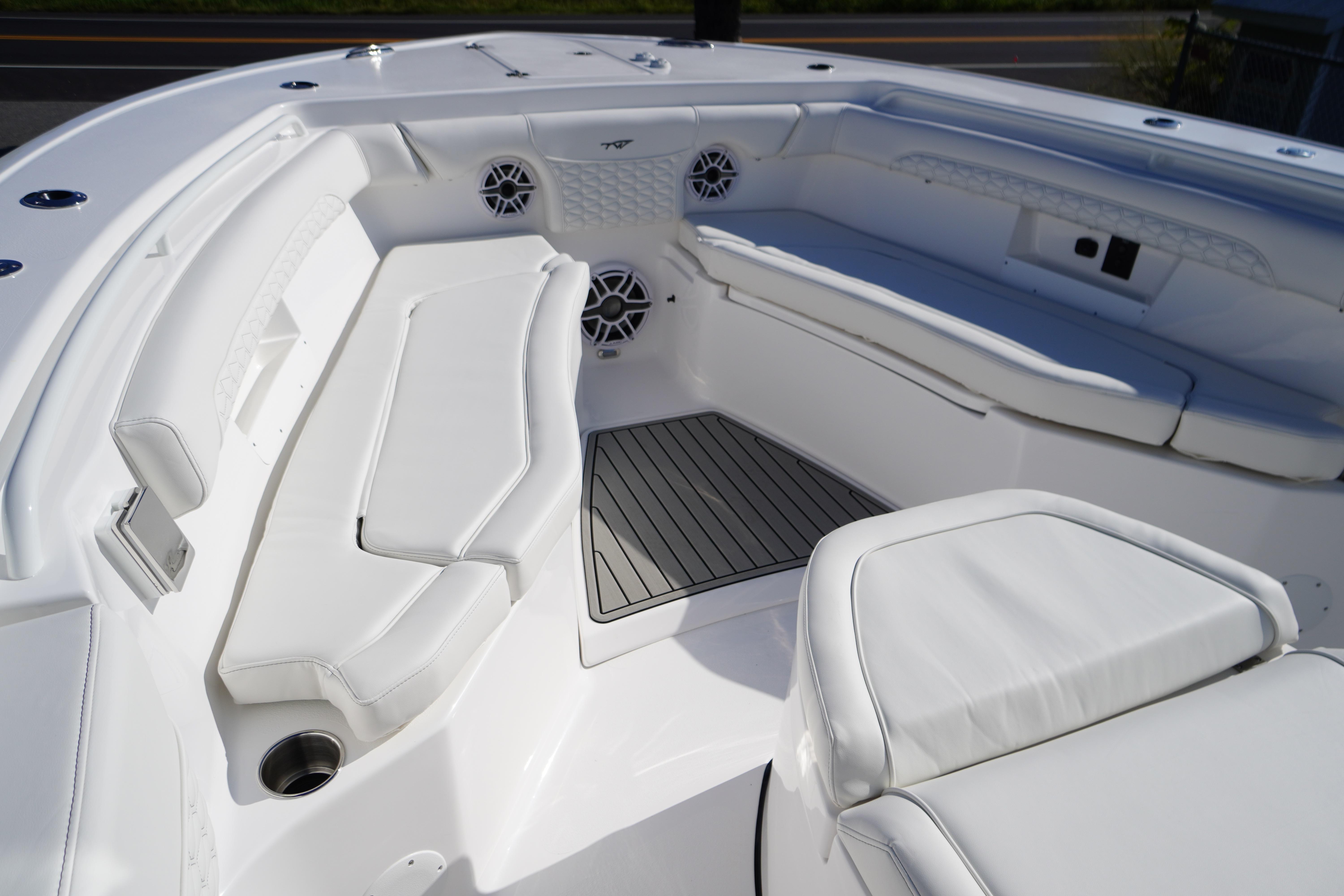 2026 Tidewater 272 LXF boat interior with white seating and sleek design.