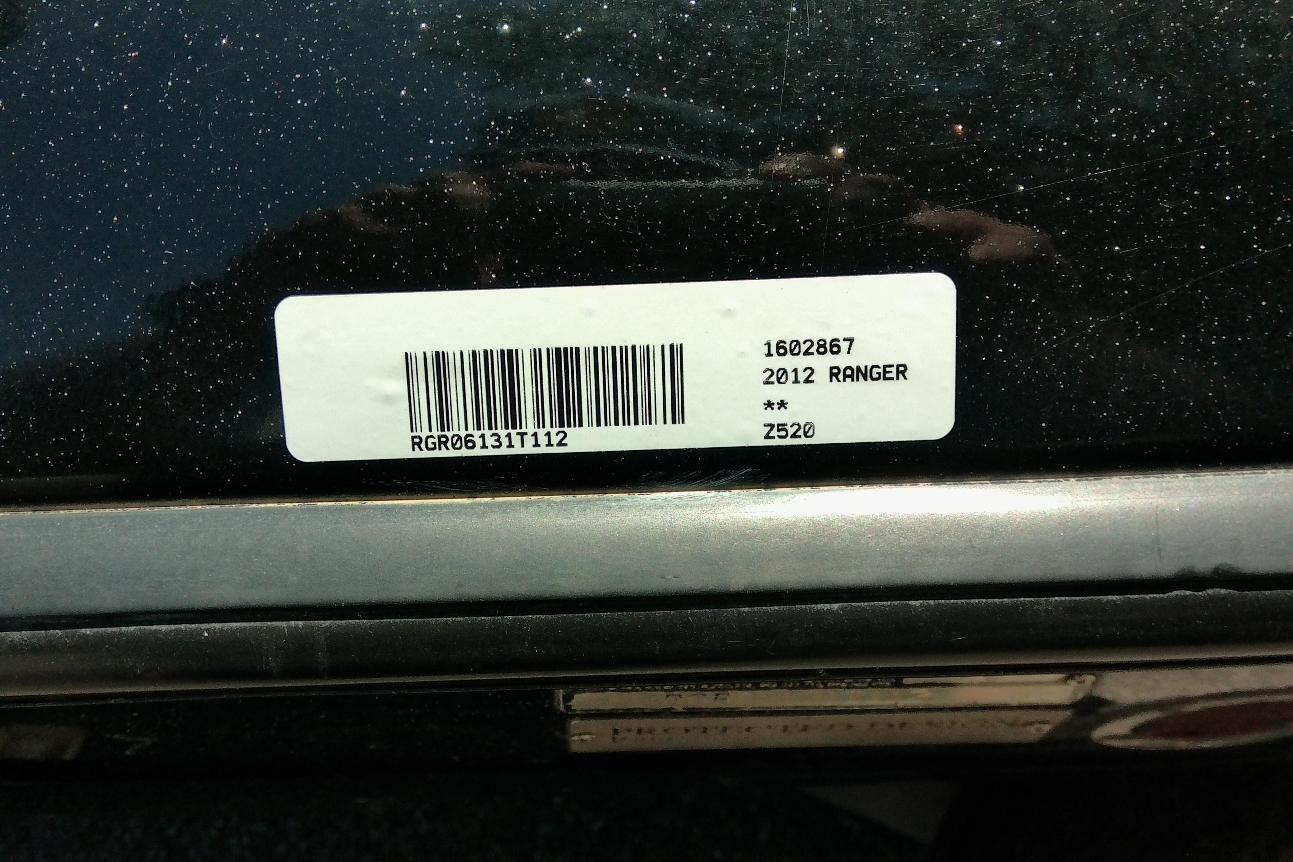 Barcode label on 2012 Ranger Z520 vehicle, displaying model and serial number.