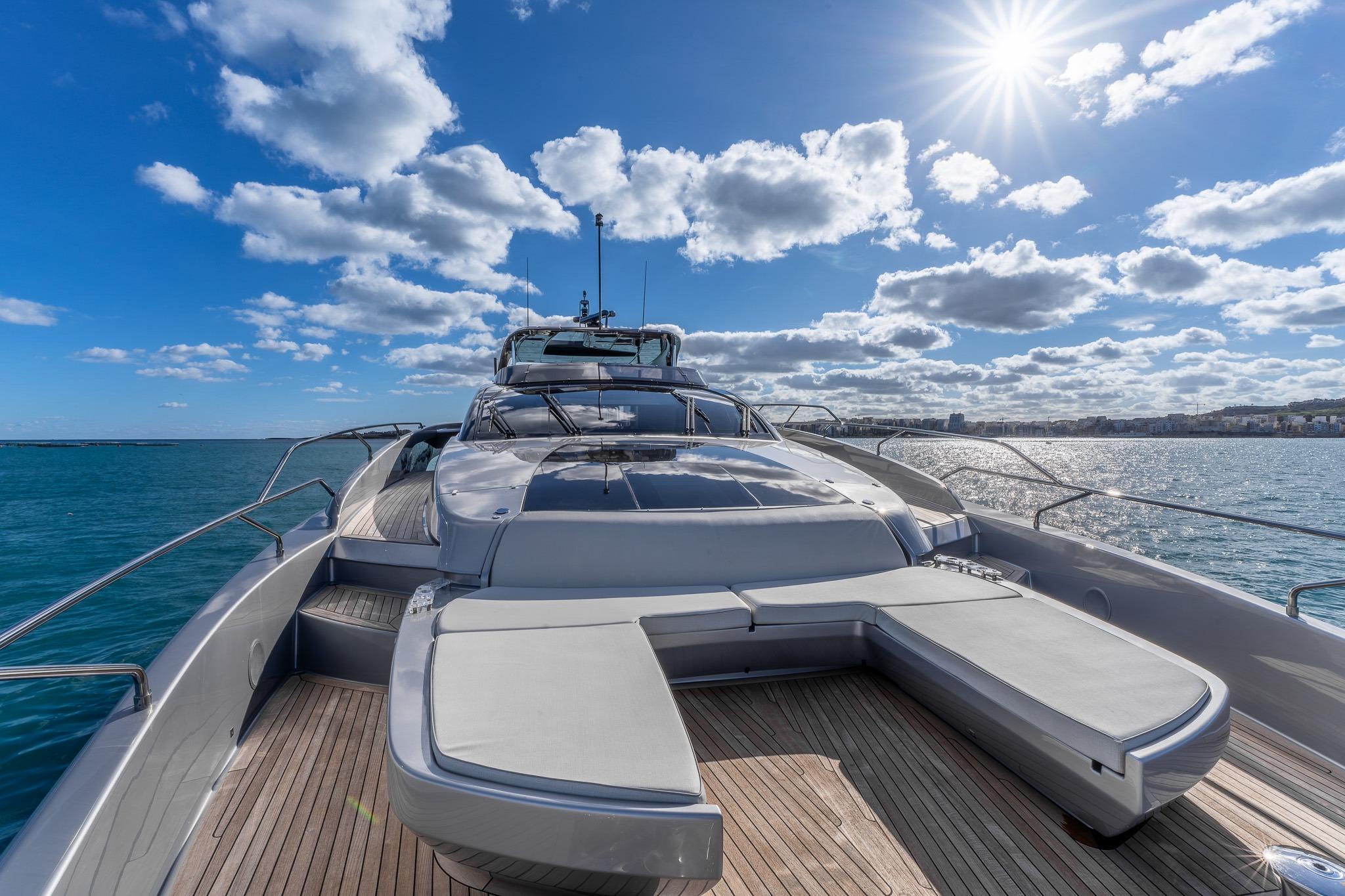 Luxurious 2020 Riva 90' Argo yacht on open sea under sunny sky.
