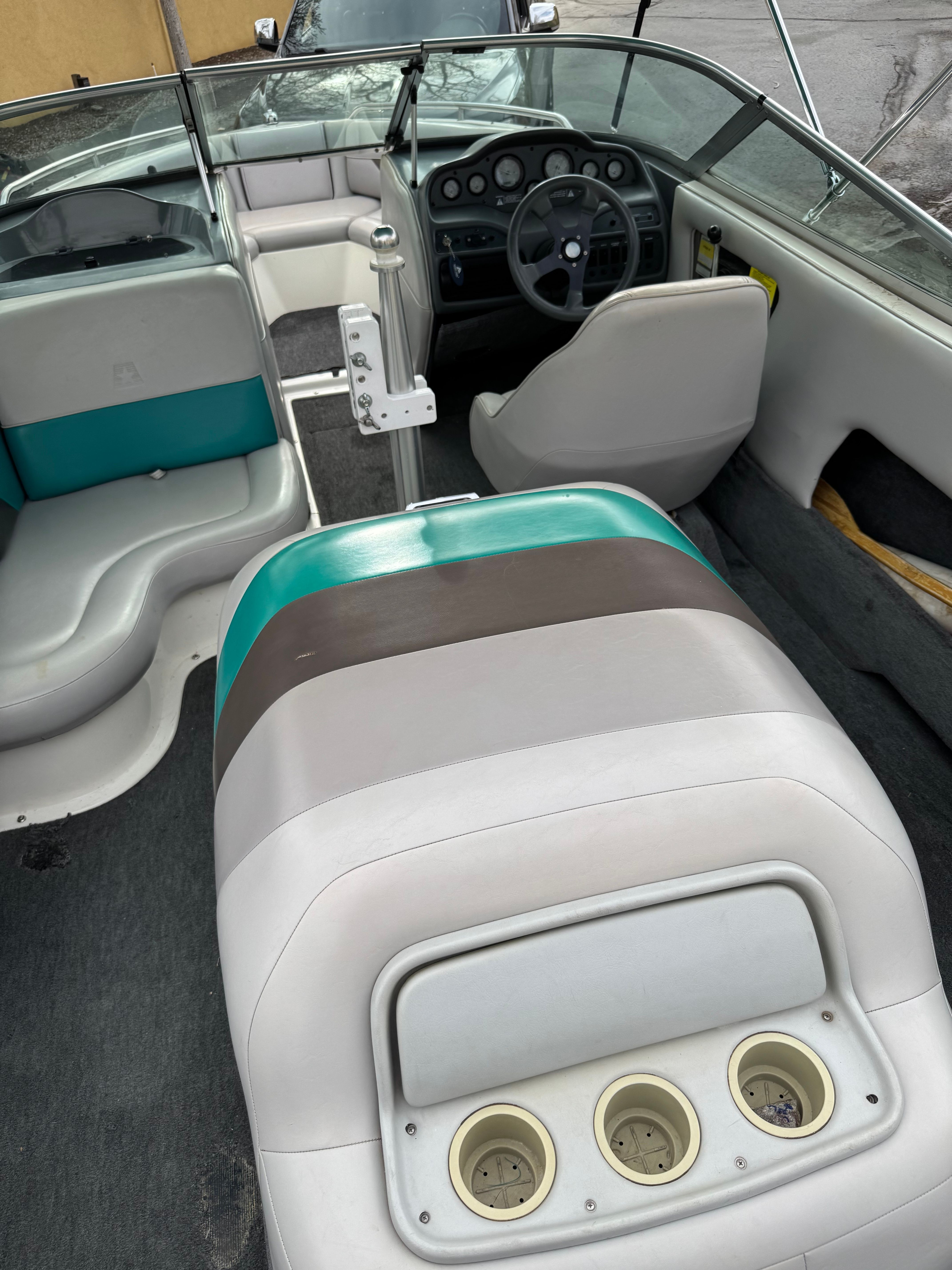 Interior of a 1993 MasterCraft Maristar boat with gray and teal seating.