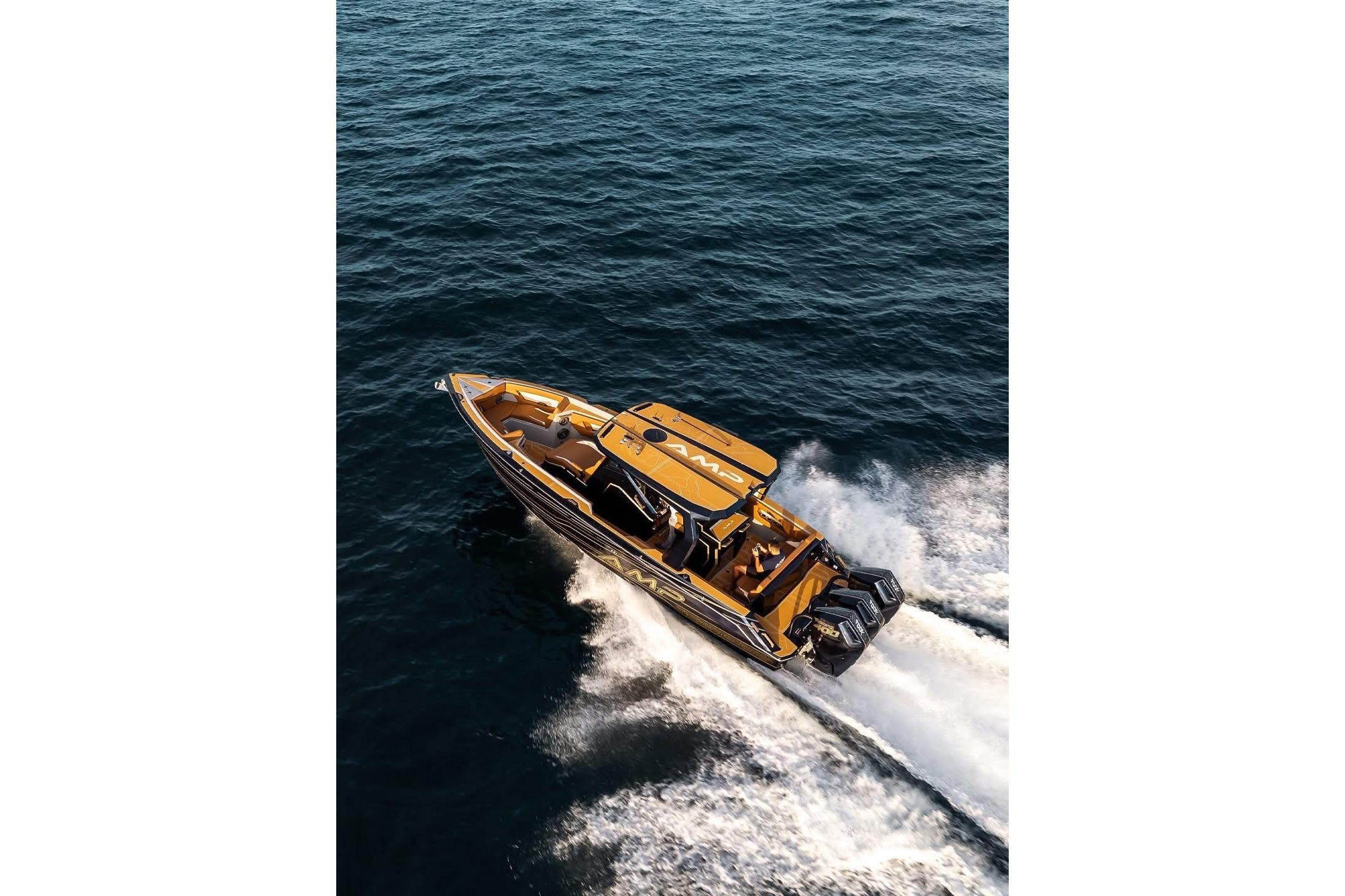 Aerial view of 2027 AMP 34S speedboat cruising on open water.