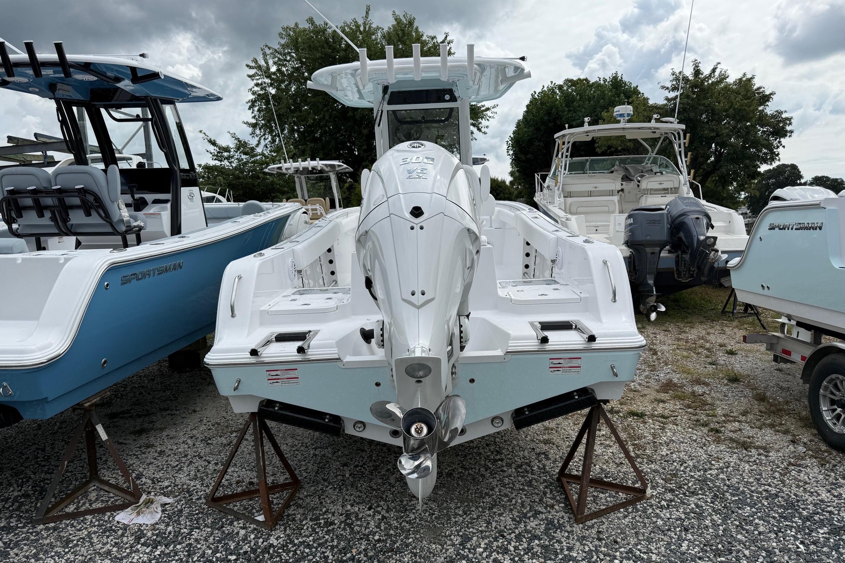 2026 Sportsman Heritage 231 Center Console boat displayed outdoors on stands.