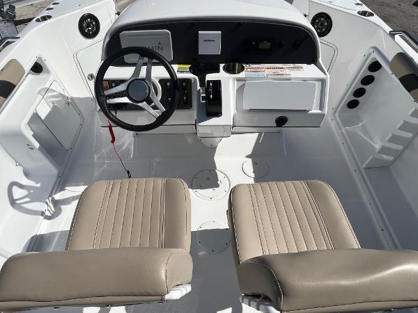 2022 Hurricane Center Console SS 231 OB boat interior with steering wheel and beige seats.