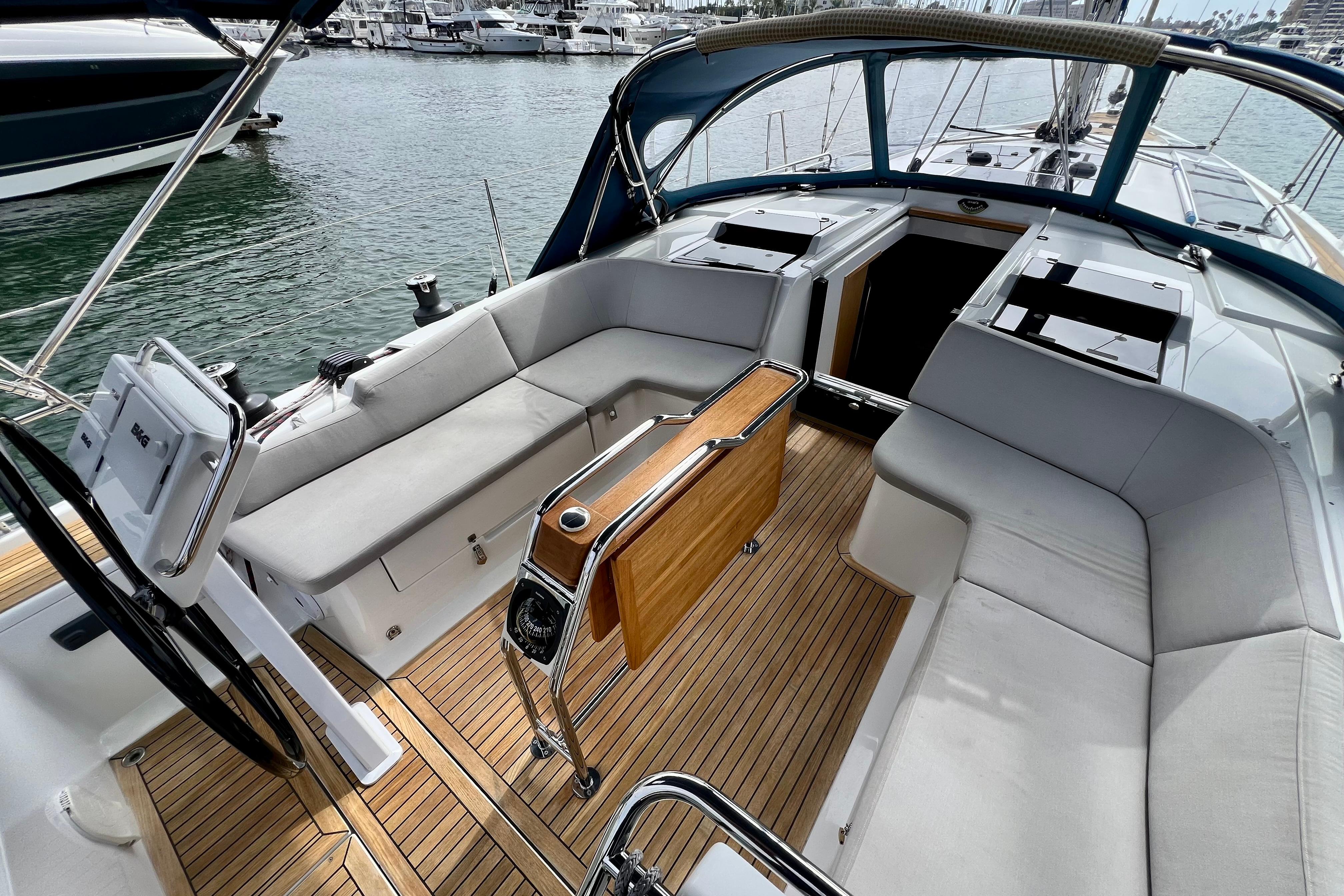 Interior view of a 2016 Hanse 455 yacht with elegant seating and wooden flooring.