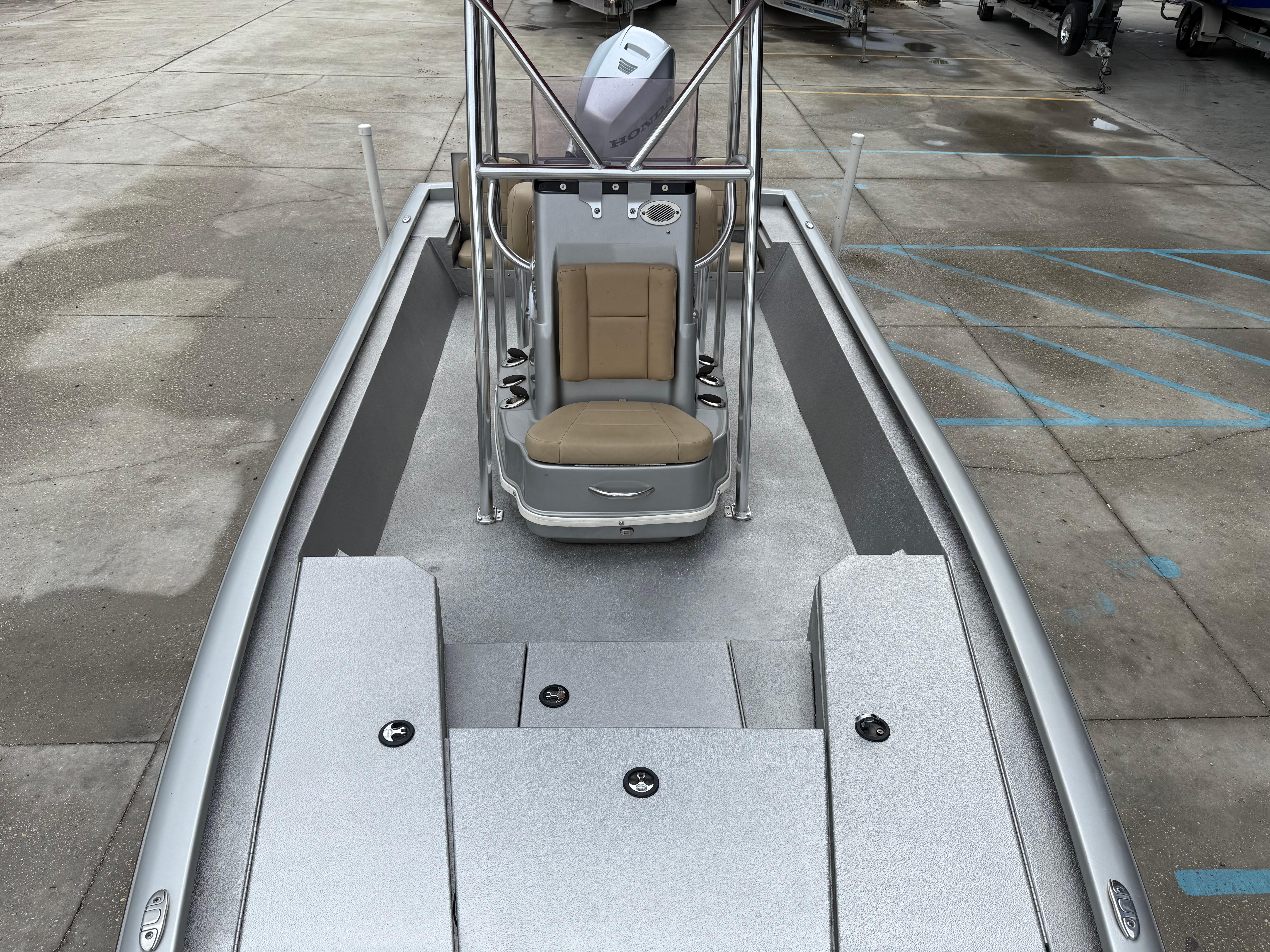 2020 Avid 23 FS Platinum boat interior with seating and storage compartments.