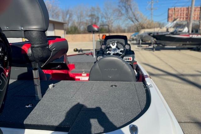 2026 Nitro Z17 boat interior with seats and steering wheel, parked outdoors.