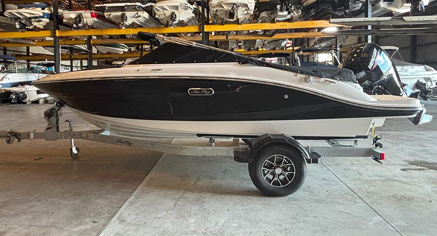2025 Sea Ray SPX 190 Outboard boat on trailer in storage facility.