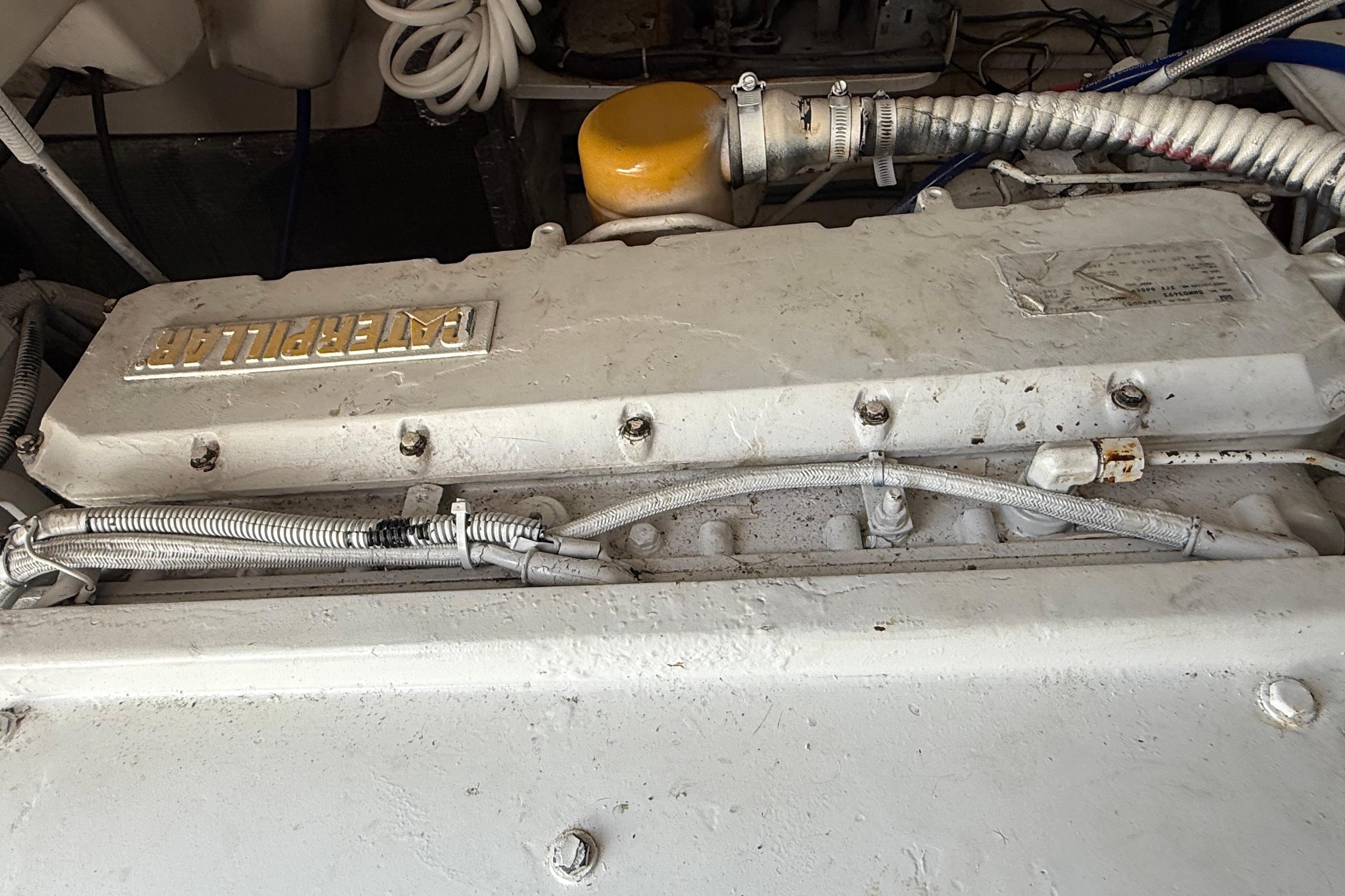 Engine compartment of a 1999 Ocean Yachts 40 Express, featuring a Caterpillar engine.