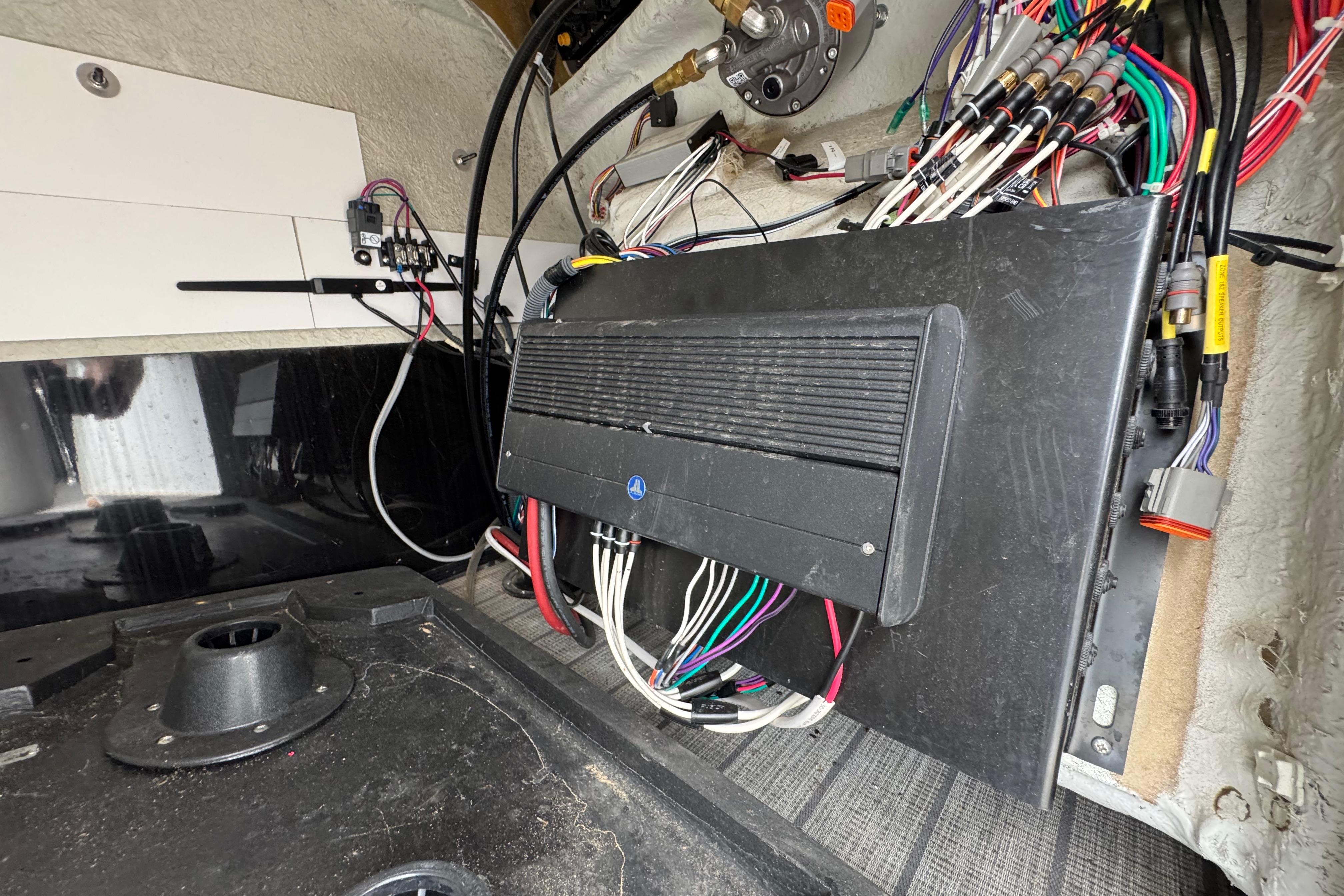 Electrical wiring and components inside a 2023 Starcraft MX 25 DL DH boat.