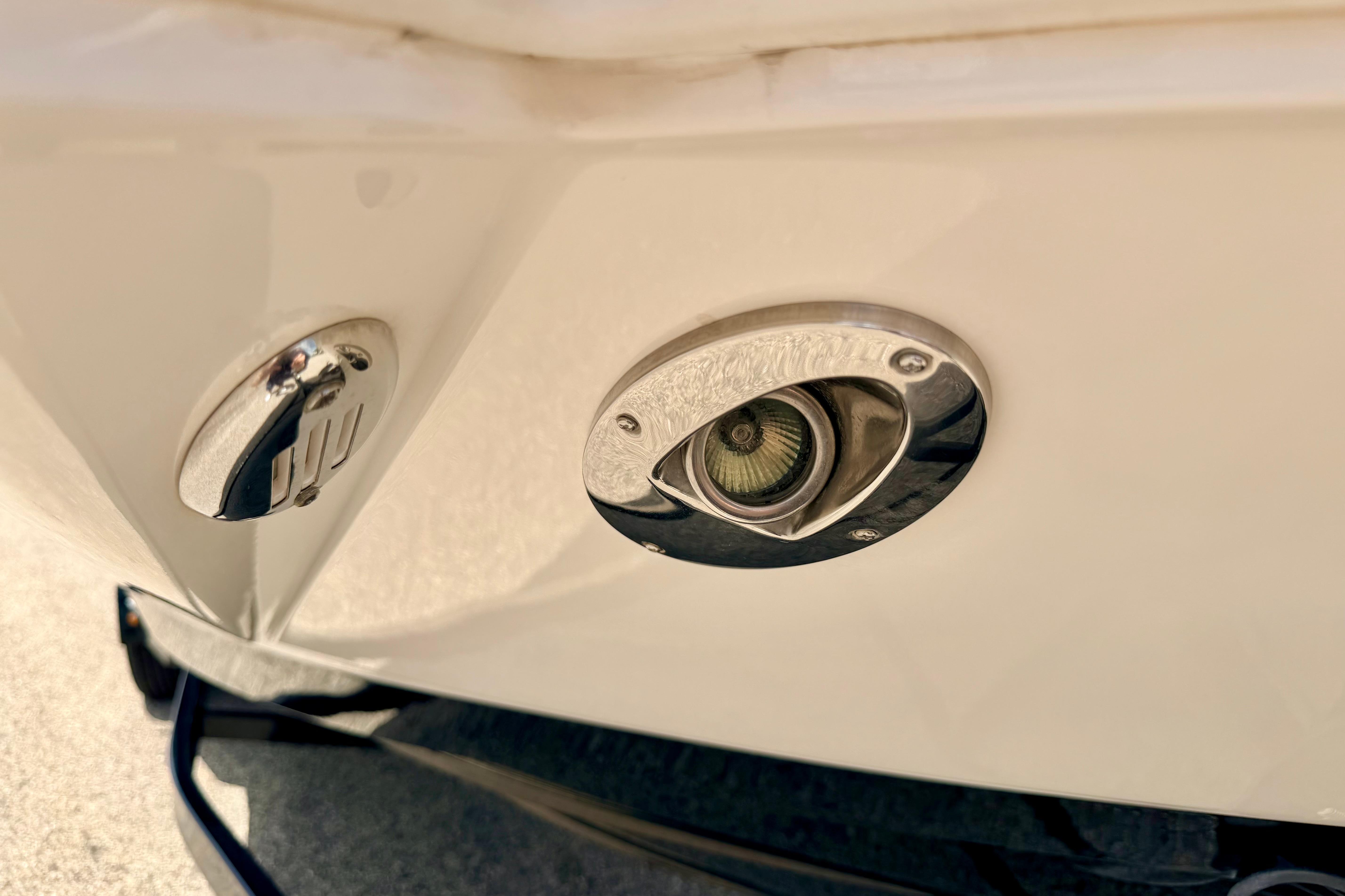 2015 Chaparral Sunesta 264 boat detail showing stainless steel fittings and light fixture.