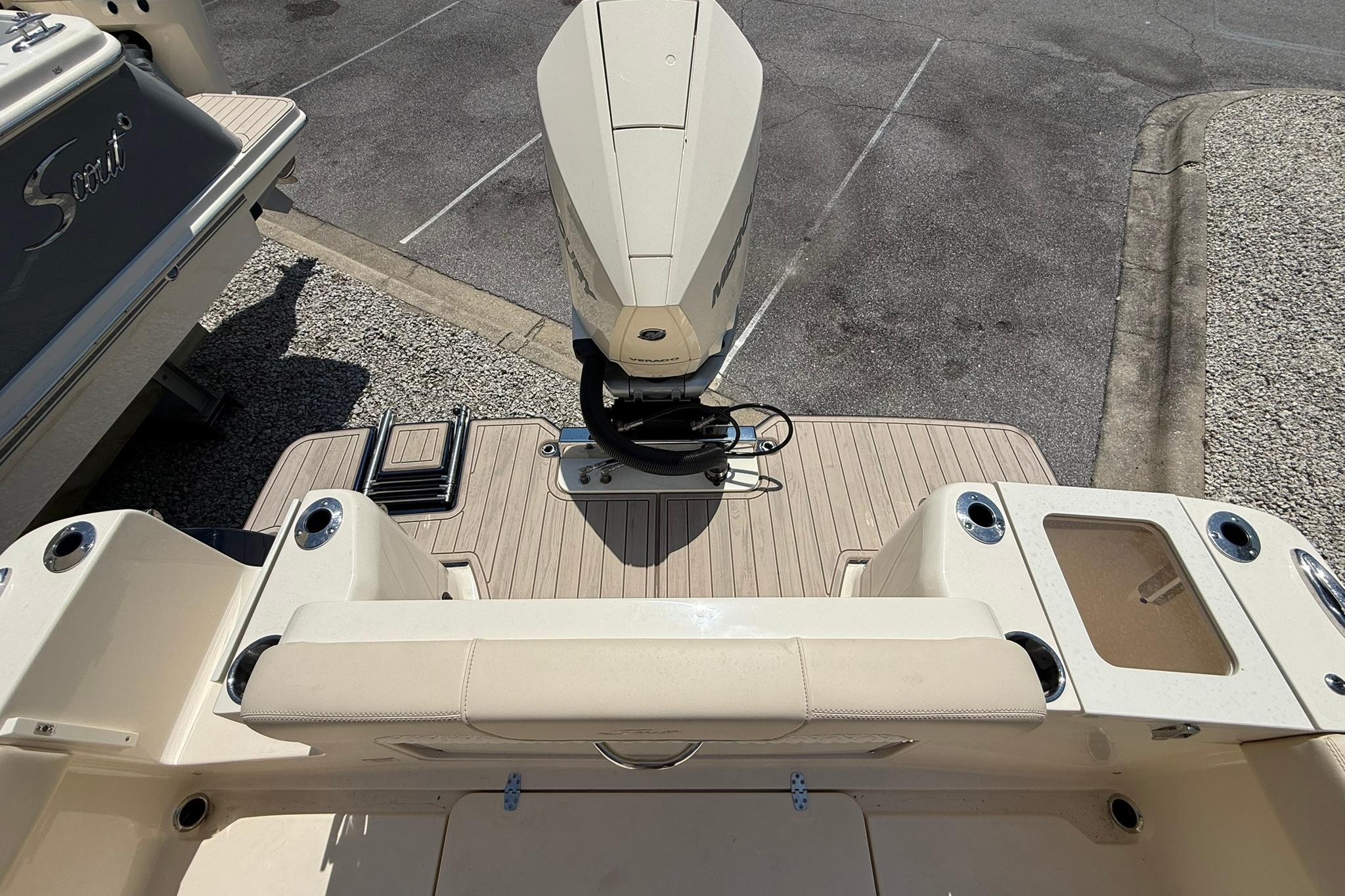 2027 Scout 240 XSF boat with outboard motor and spacious deck.