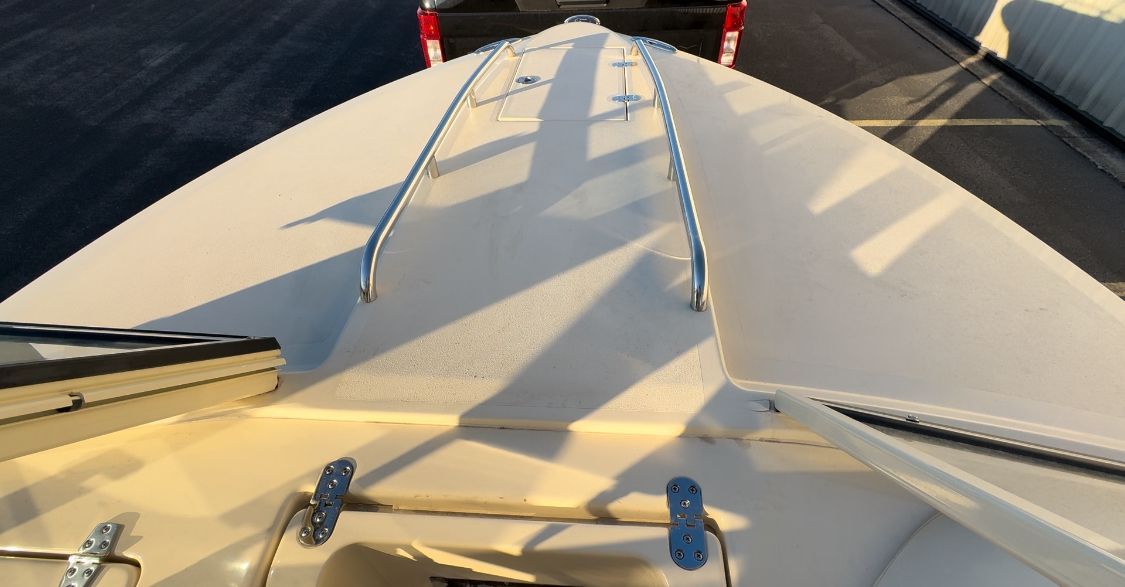 The image shows the deck of a 2018 Rossiter Coastal Cruiser with stainless steel railings.