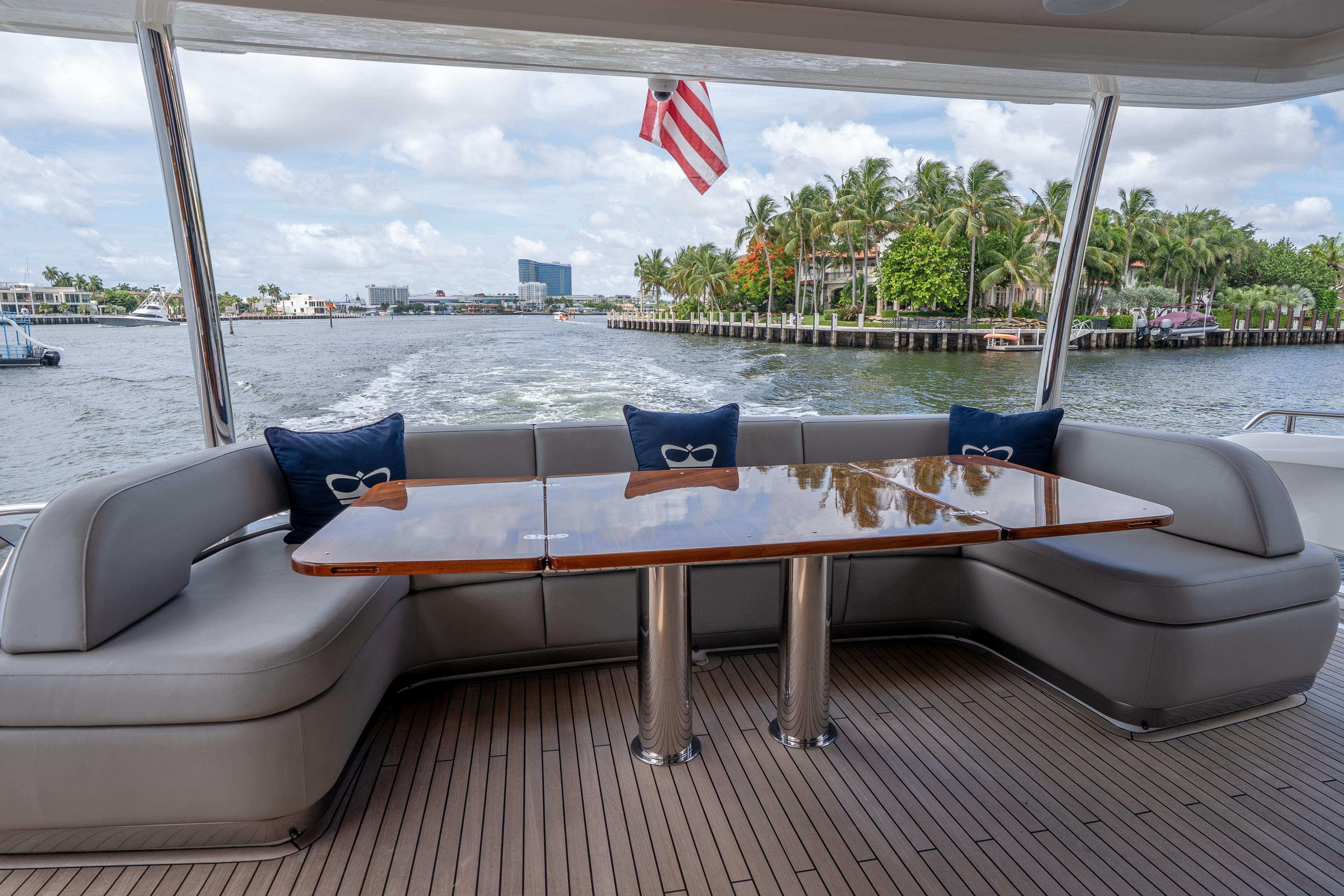 Luxurious seating area on 2020 Princess Y85 yacht with waterfront view.