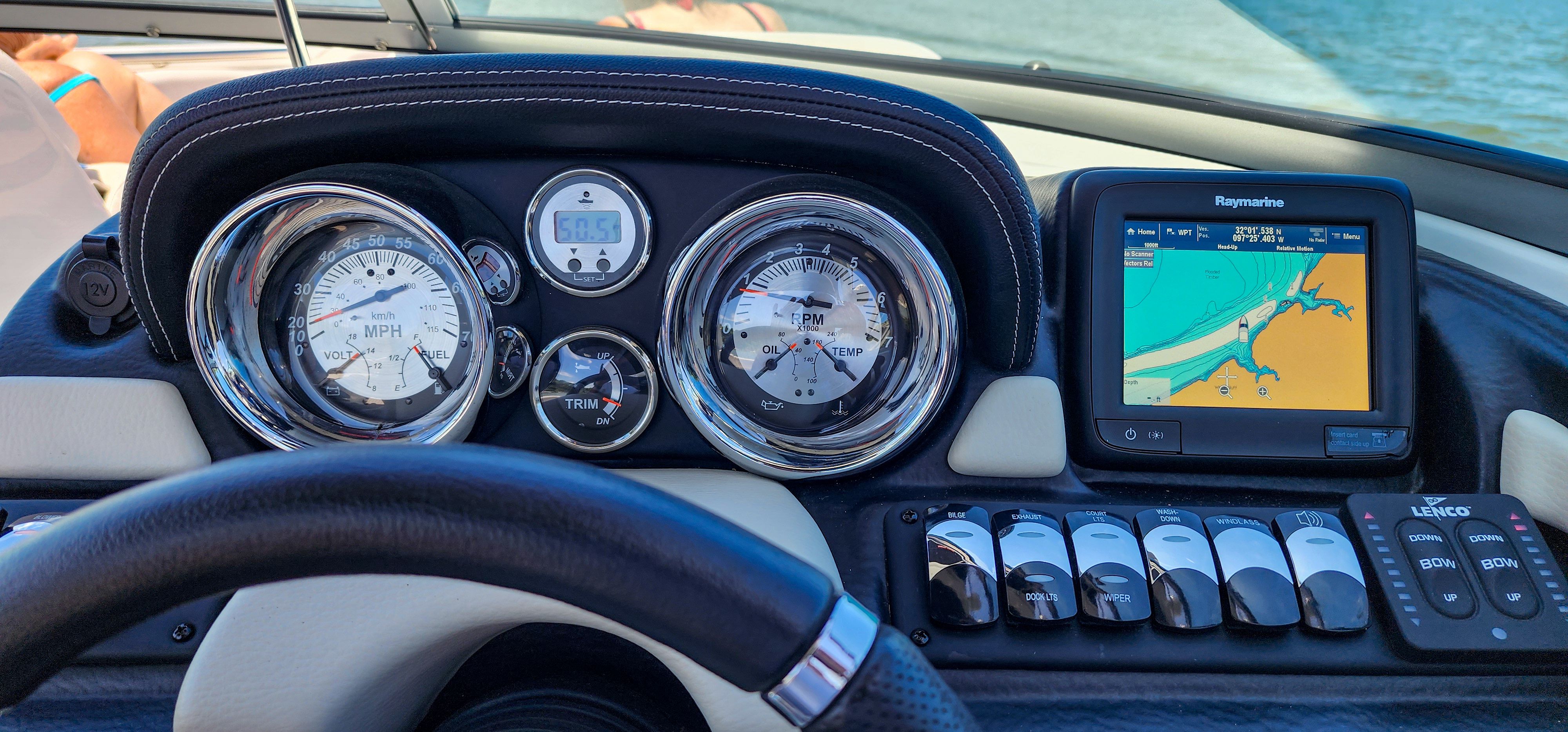 Dashboard of a Crownline 285SS with speedometer, GPS, and switches.
