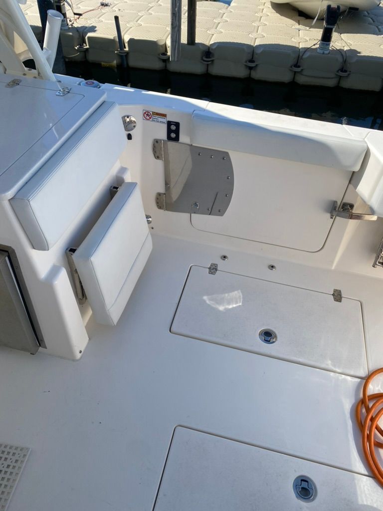 Interior of a 2023 Cobia 330 boat at the dock.