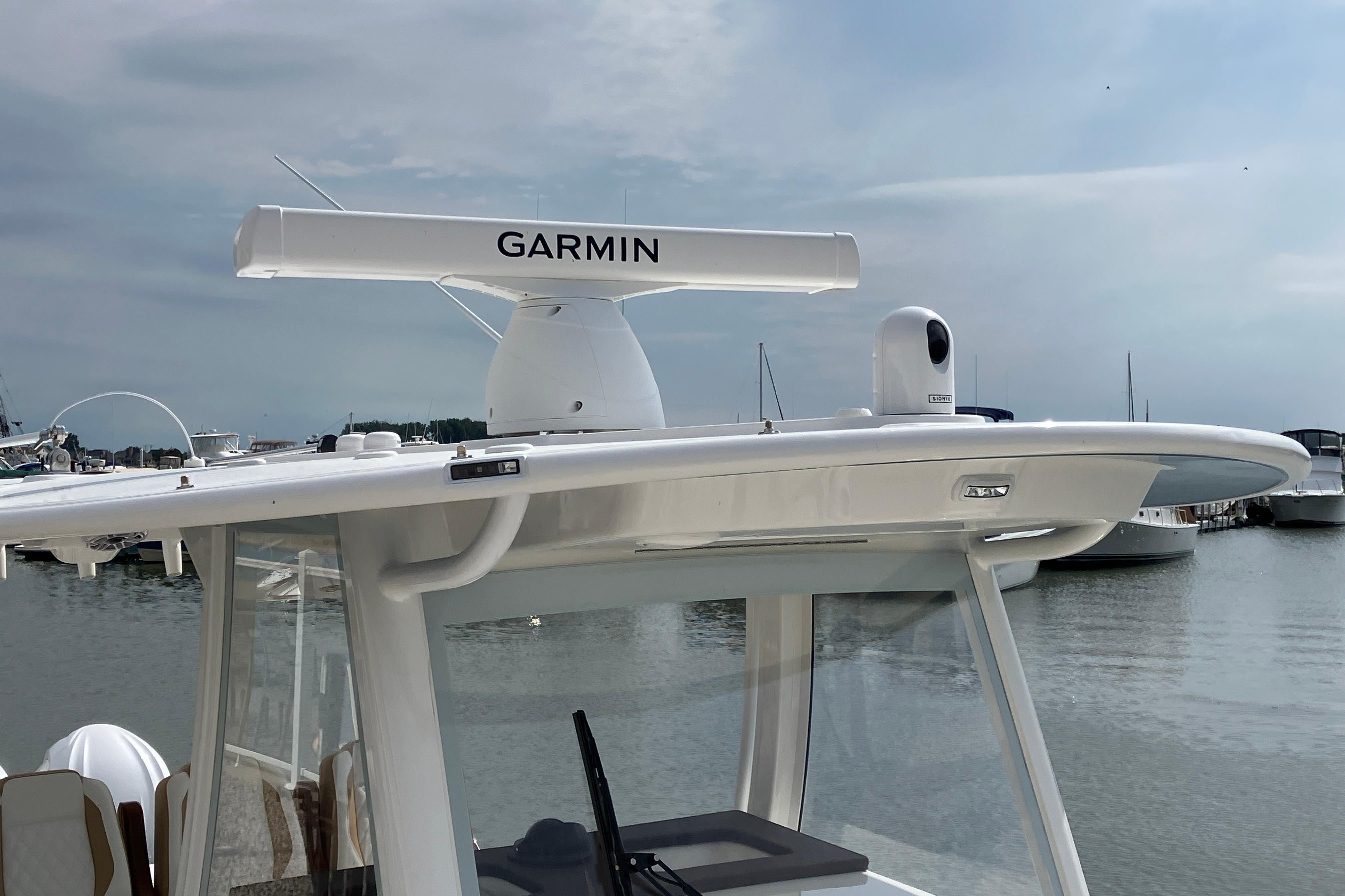 2027 Regulator 35 boat with Garmin radar system, docked at a marina.