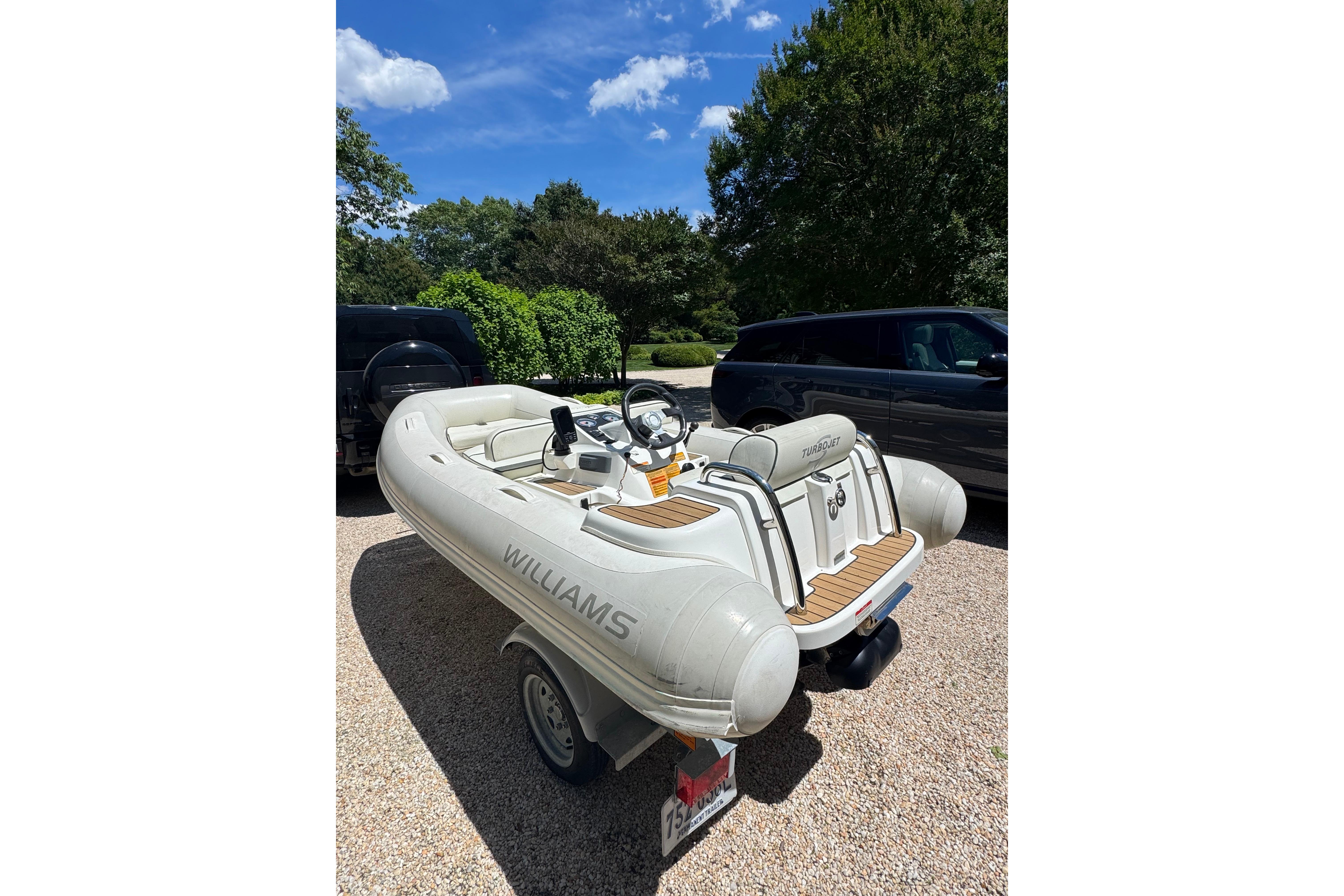 2017 Williams Jet Tenders Turbojet 325 on trailer, parked outdoors under blue sky.