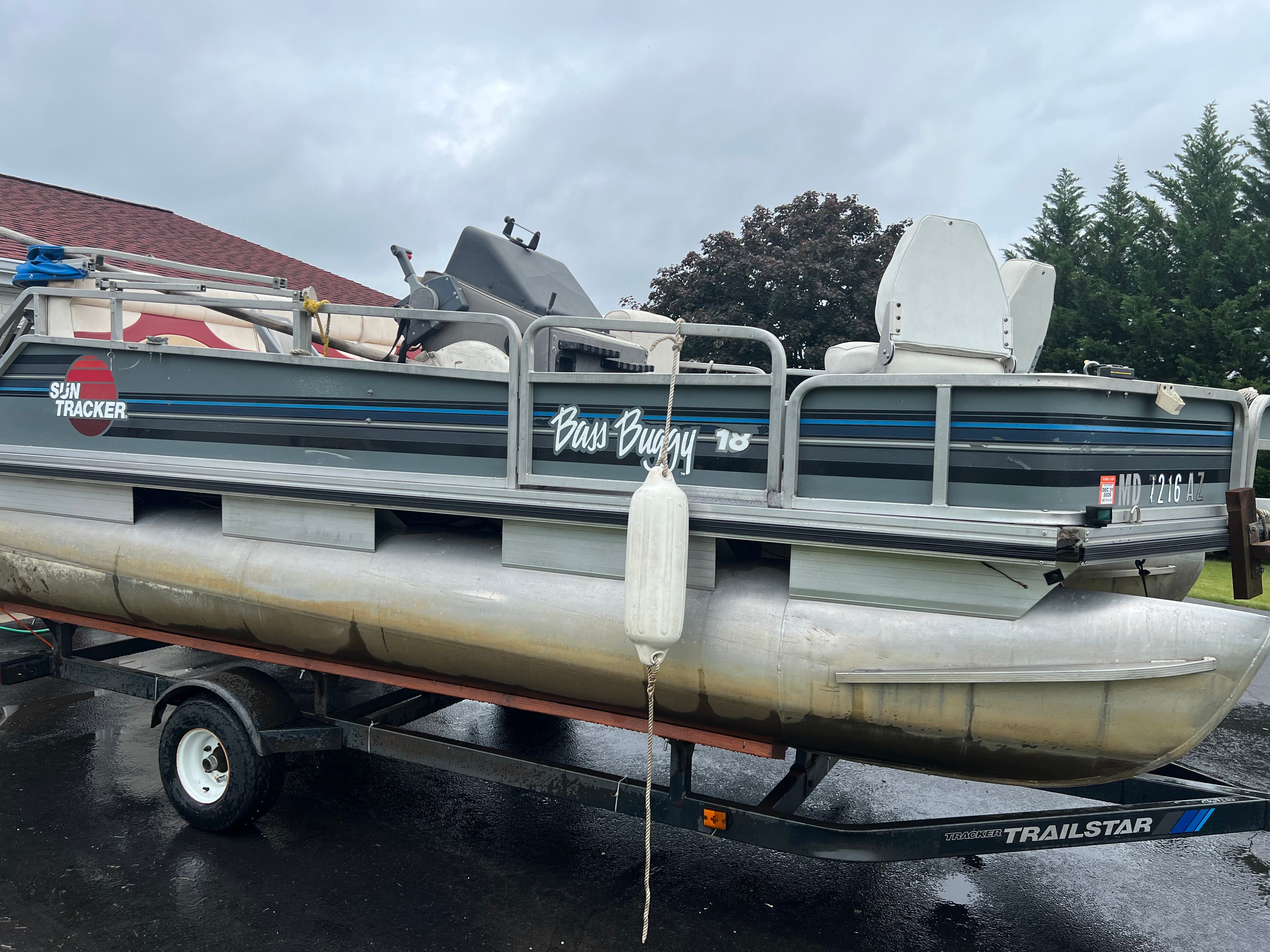 1991 Tracker Bass Buggy pontoon boat on trailer.