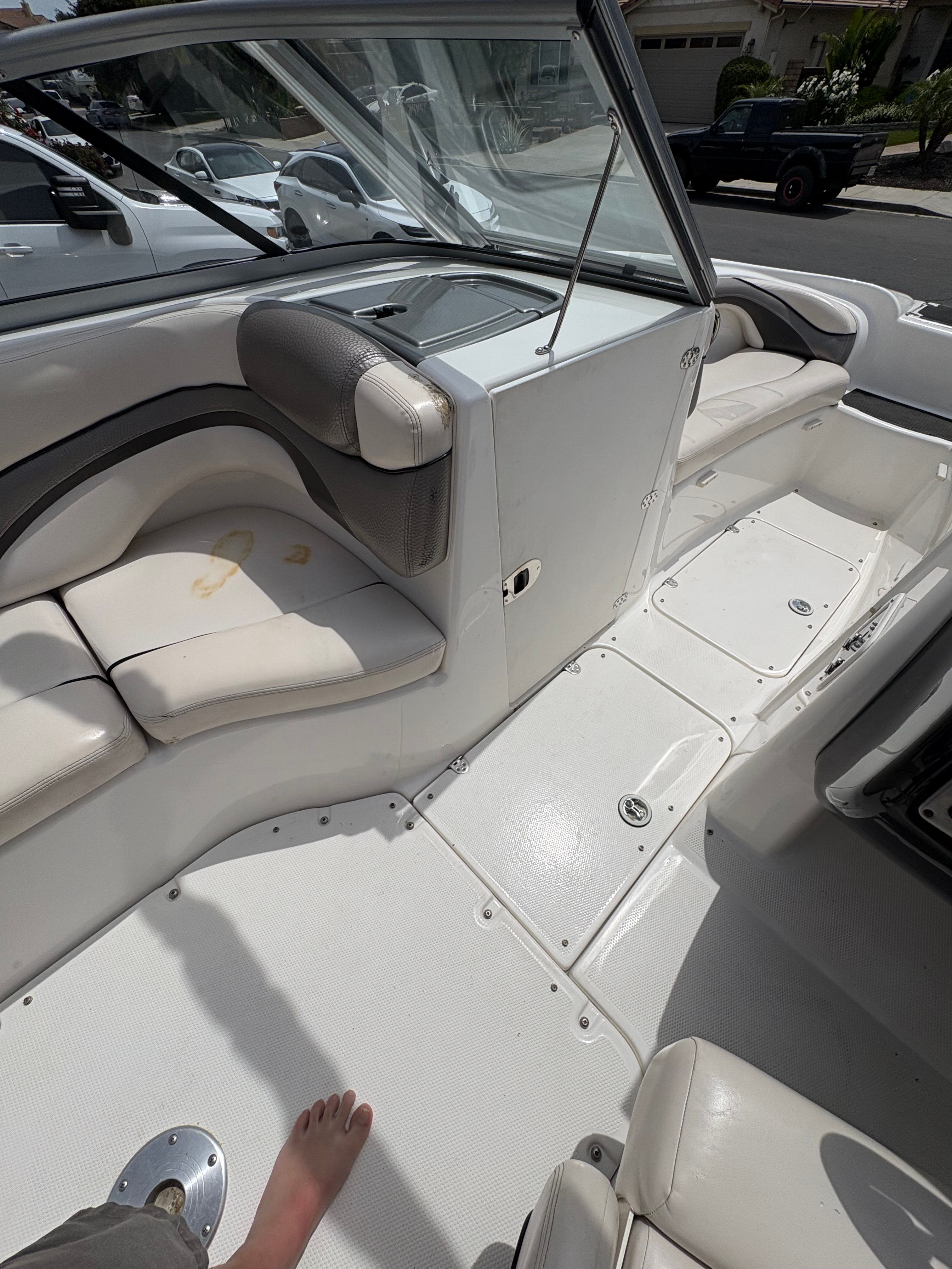 Interior of a 2009 Yamaha Boats 212X with white seating.