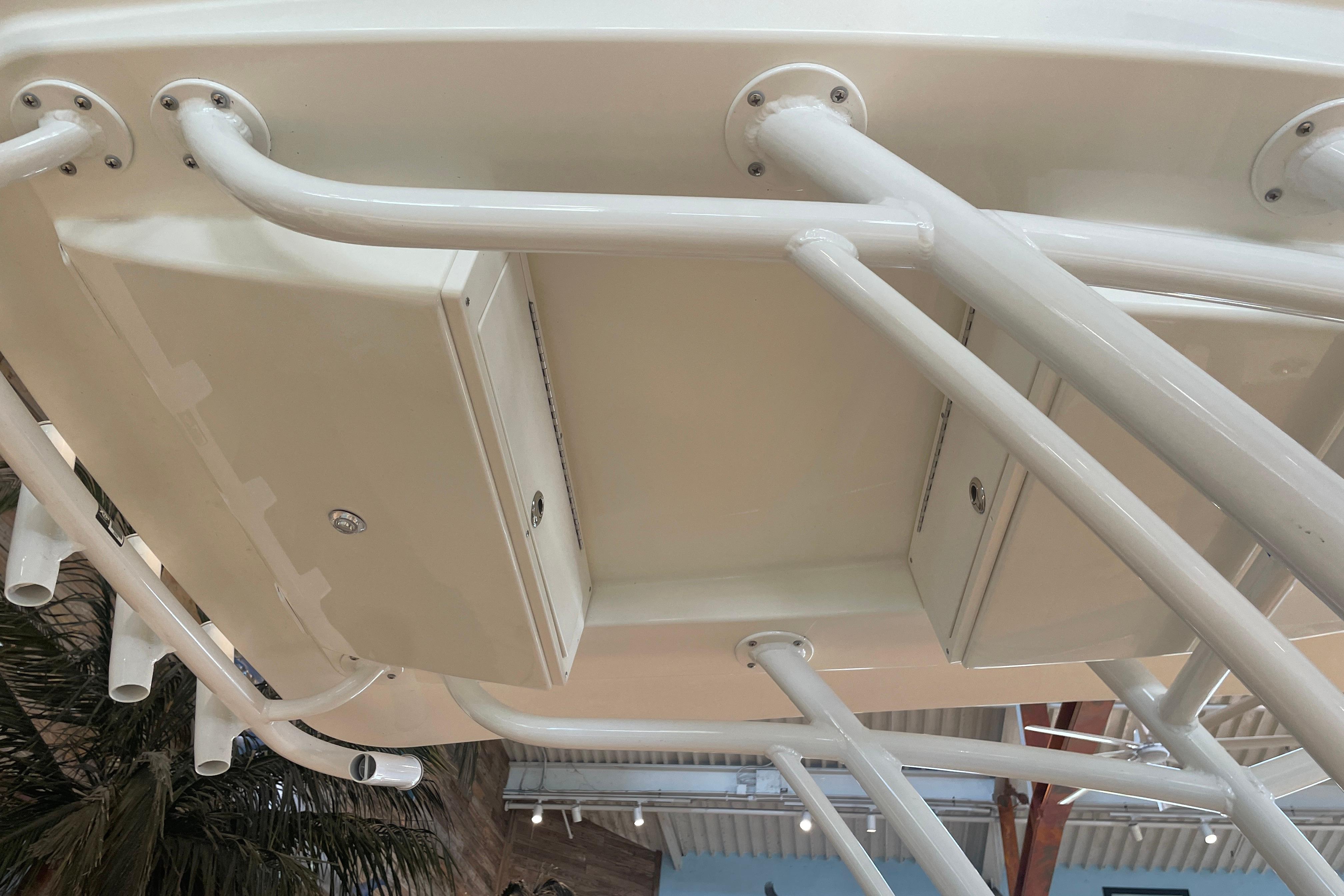 Underside view of 2026 Mako 226 Center Console boat's structure and compartments.