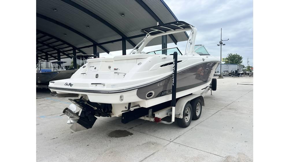 2008 Sea Ray 270SLX boat on trailer, parked under a metal canopy.