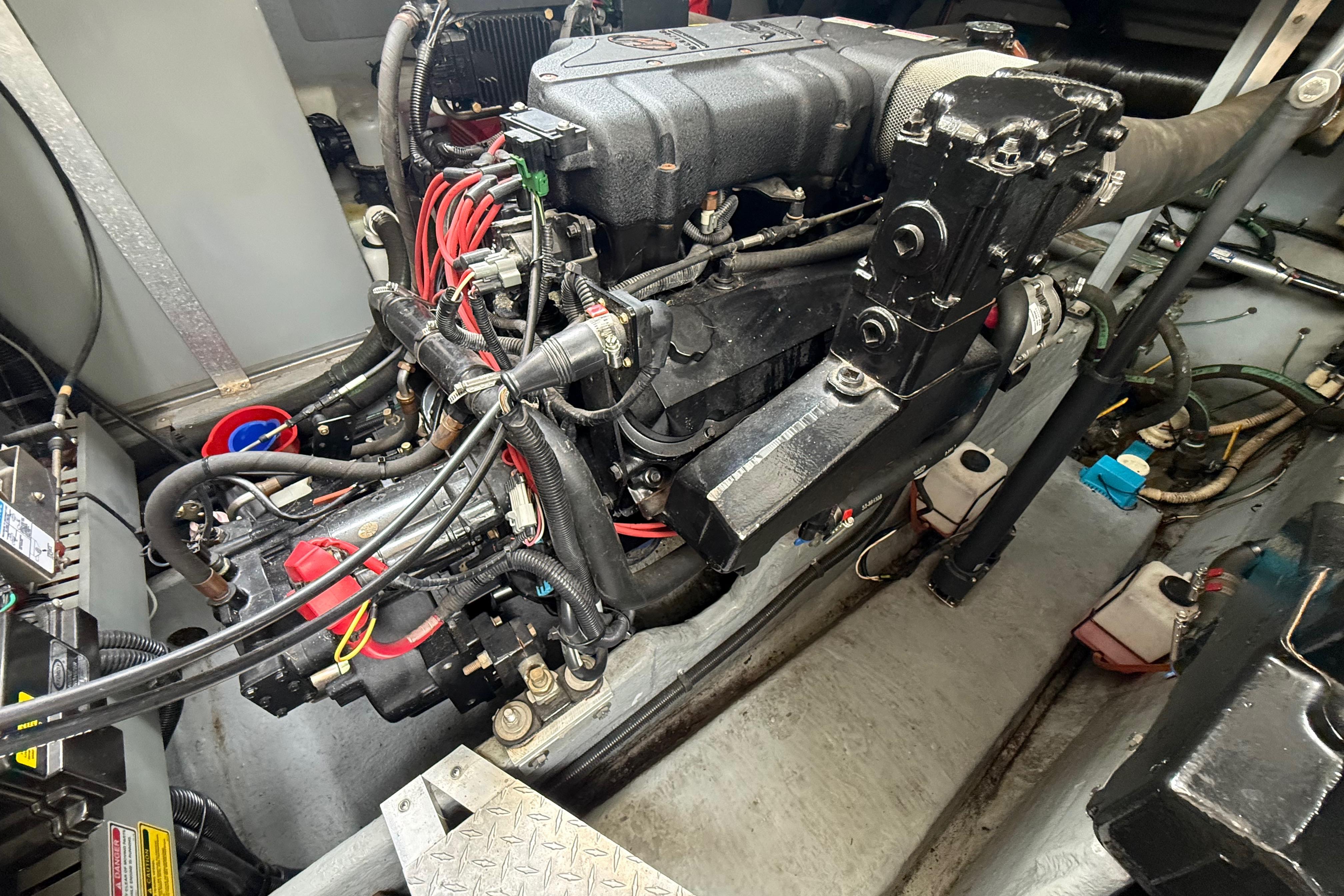Engine compartment of a 1998 Sea Ray Sundancer 400, showcasing detailed mechanical components.
