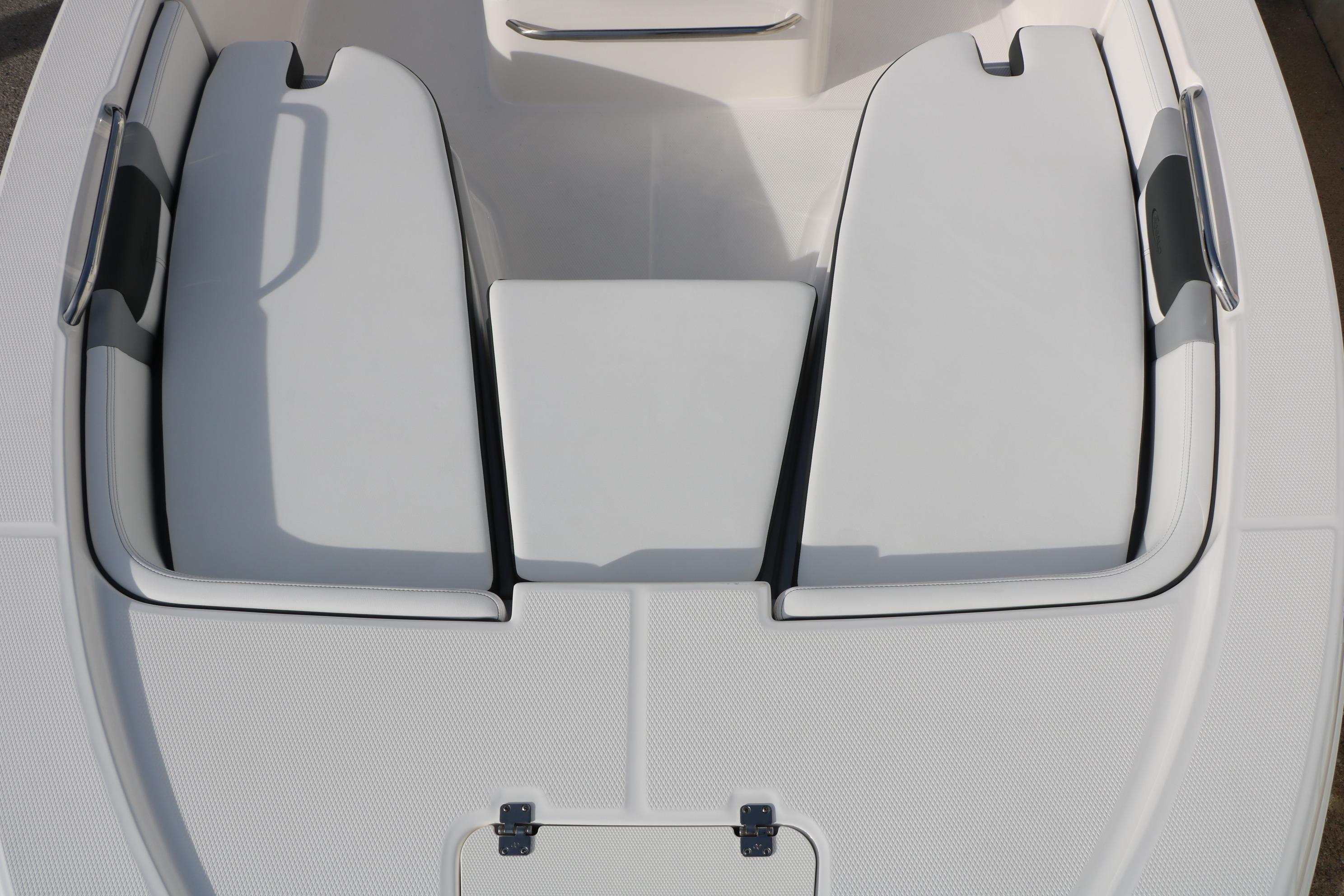 2026 Robalo 206 Cayman boat interior with cushioned seating and storage compartments.