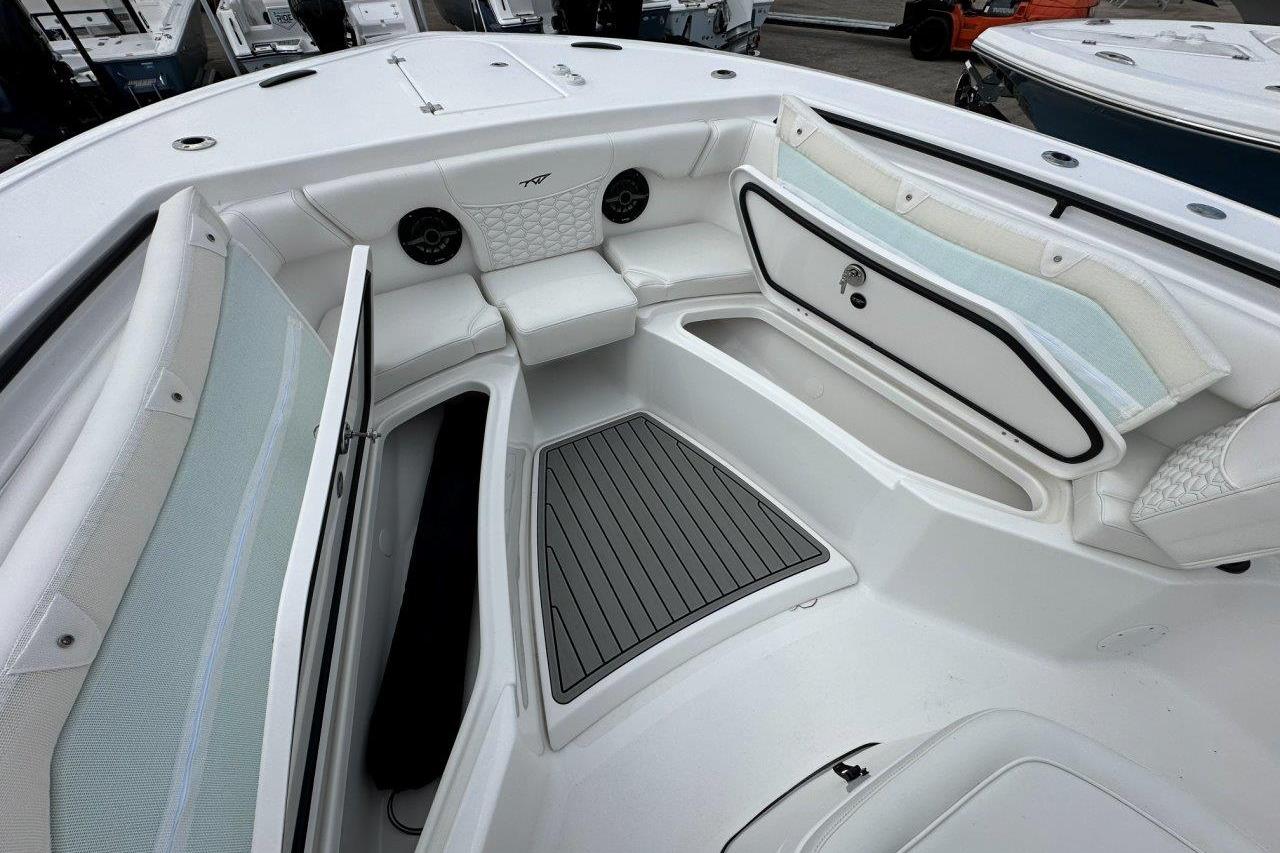 2026 Tidewater 272 LXF boat interior with seating and storage compartments.