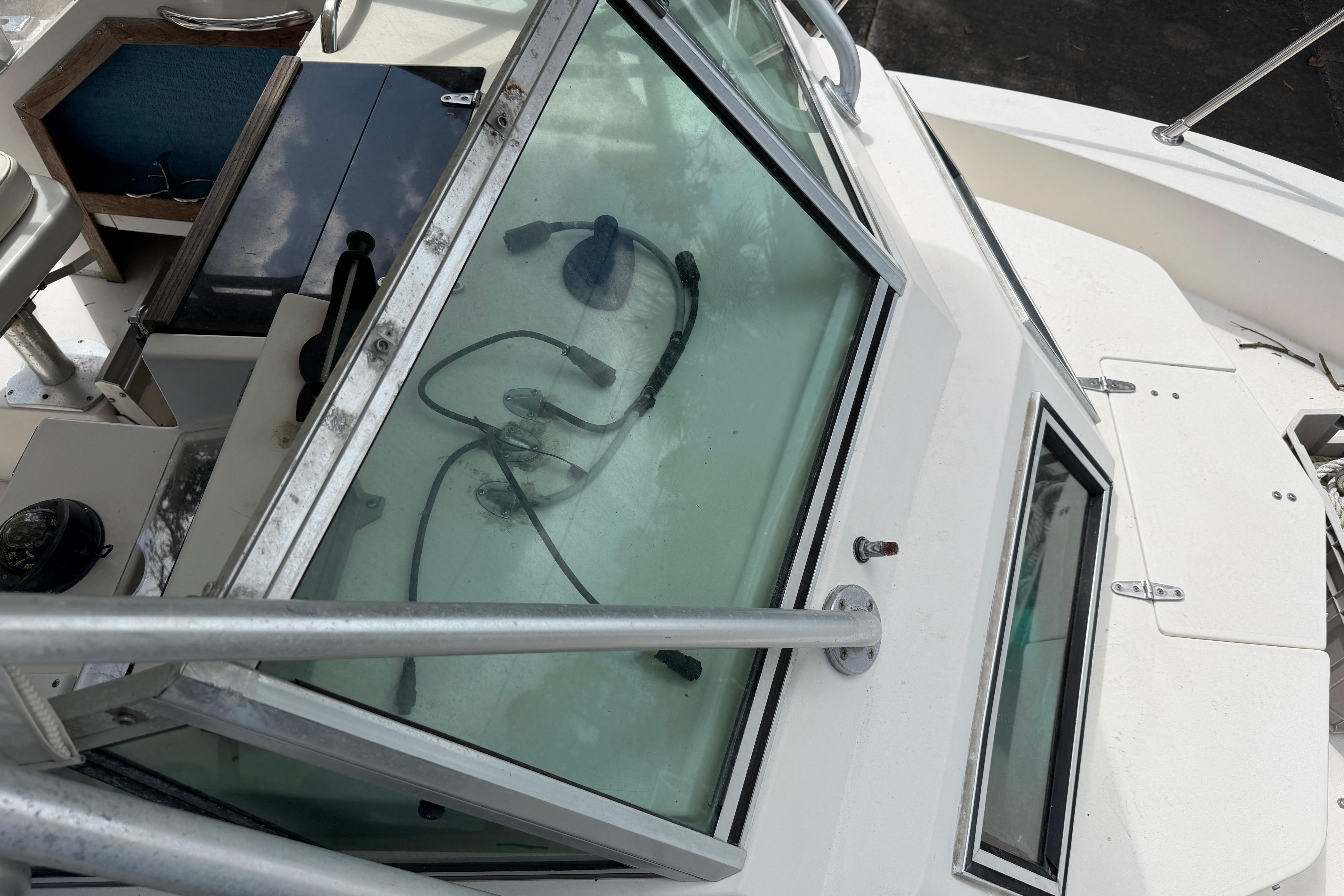 1987 Grady-White Seafarer 226 boat cockpit with visible controls and windshield.