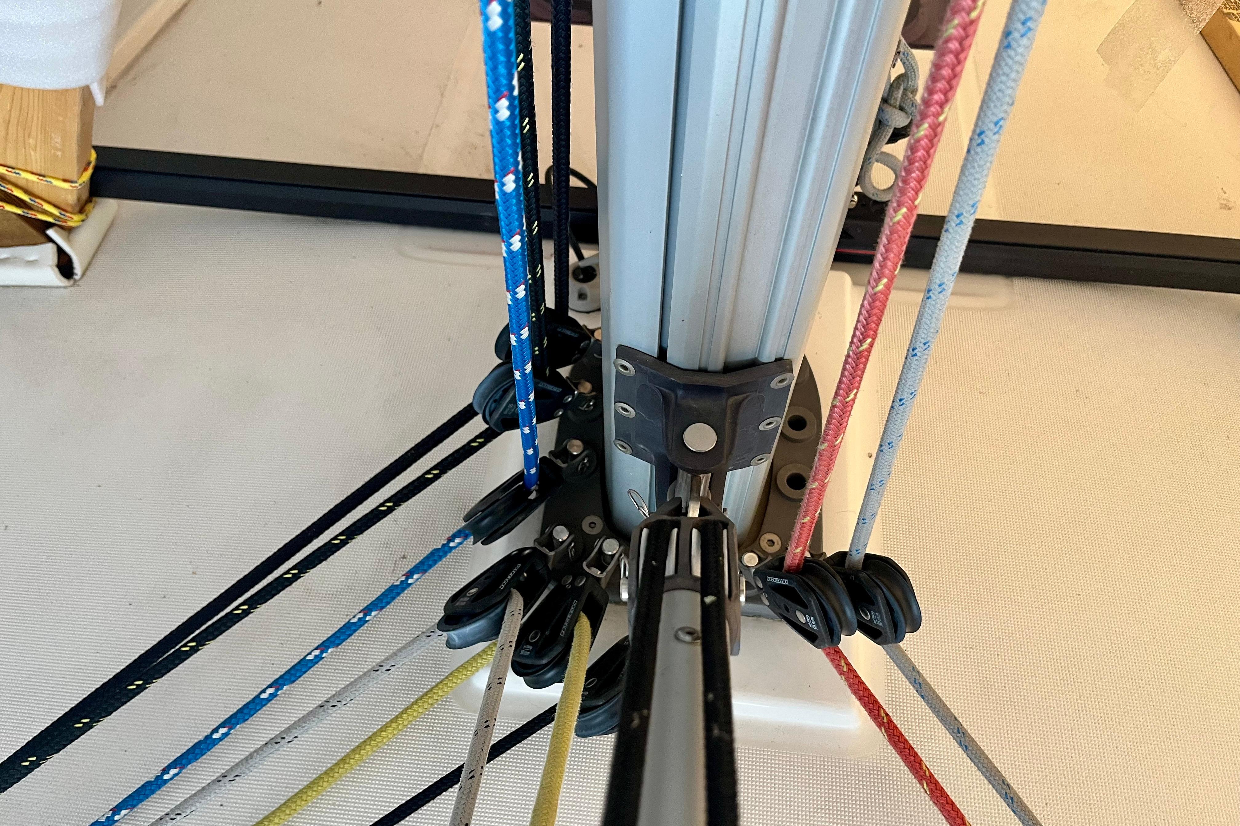 Close-up of Beneteau Oceanis 35.1 sailboat rigging, showcasing colorful ropes and pulleys, 2019 model.
