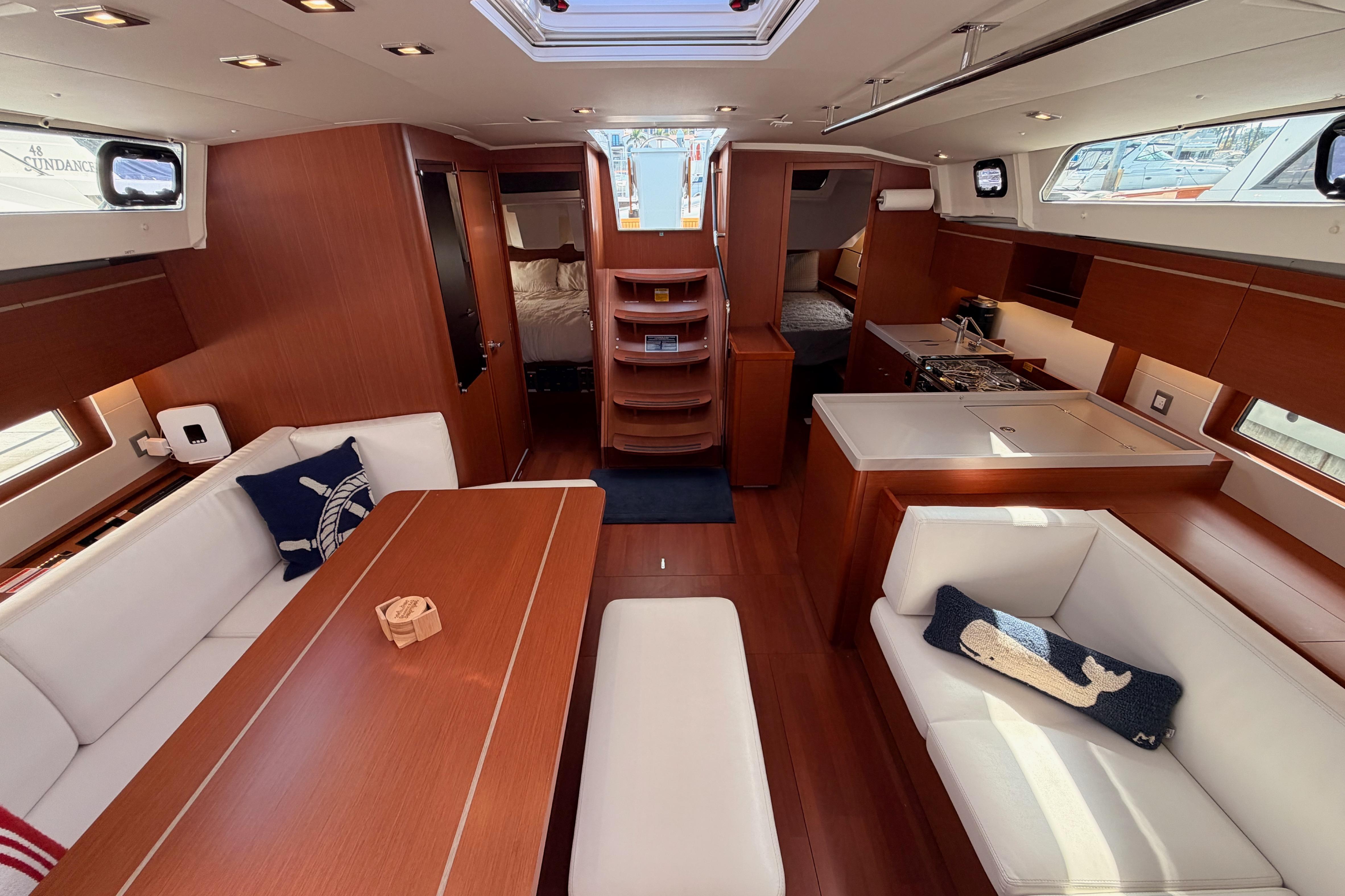 Luxurious interior of 2020 Beneteau Oceanis 46.1 yacht with elegant wood finish and modern amenities.