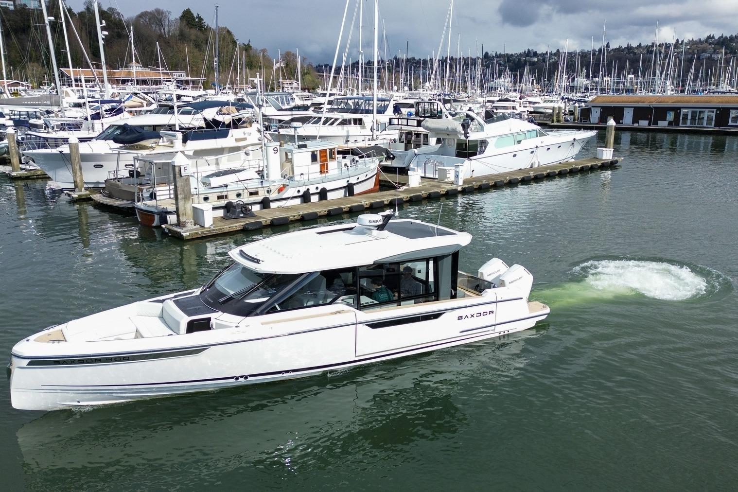 2026 Saxdor 400 GTC yacht docked in a marina with surrounding boats.