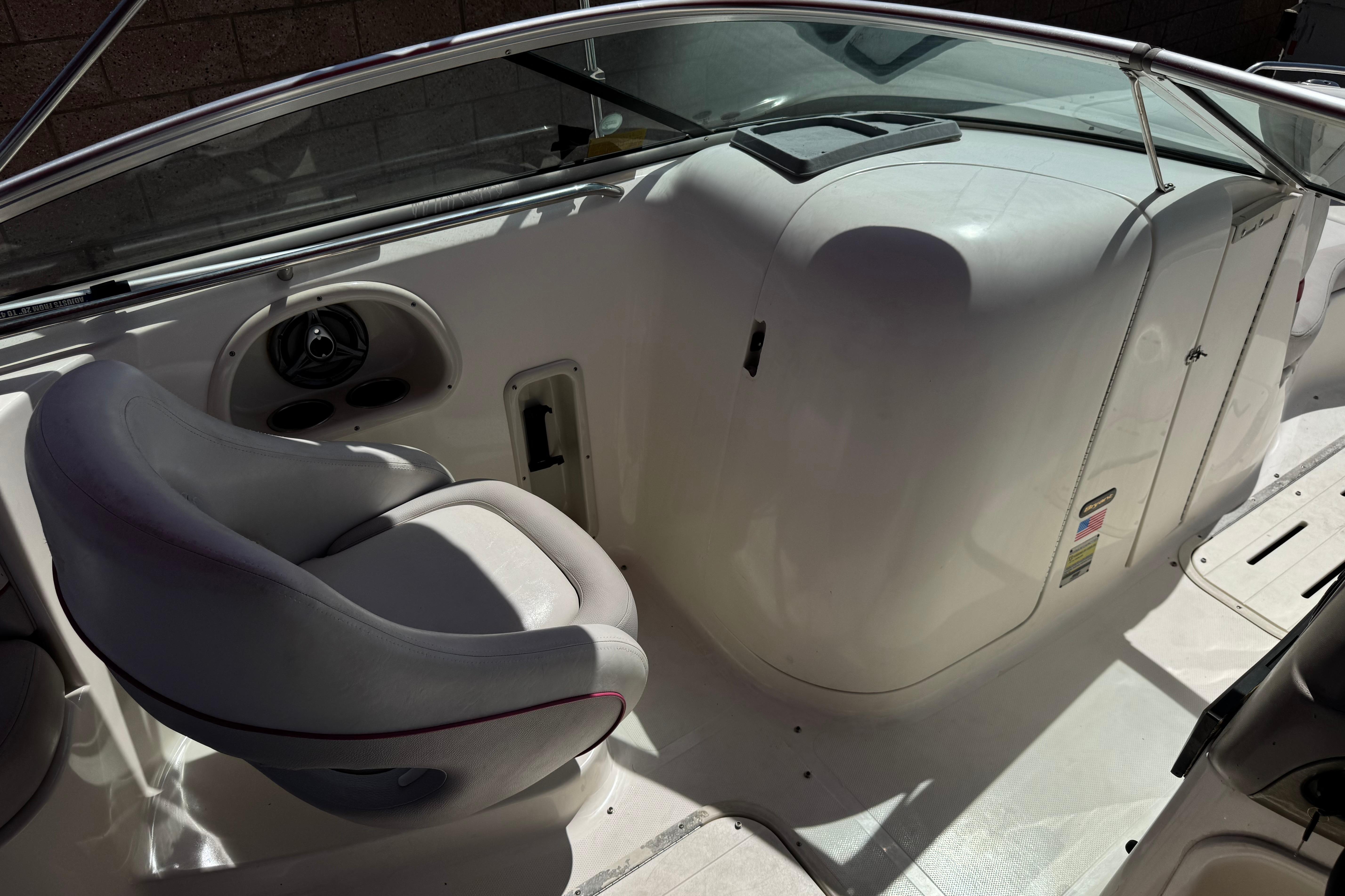 2010 Bryant 255 boat interior with seating and control panel.