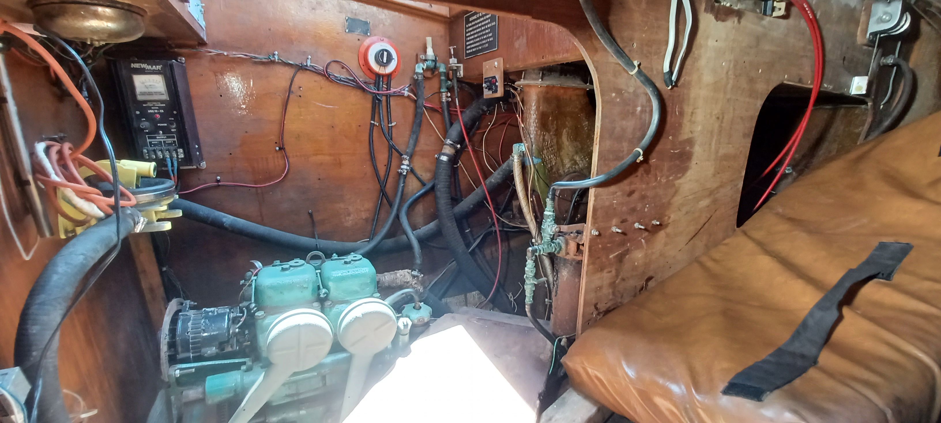 Interior of a boat with engine and wiring.