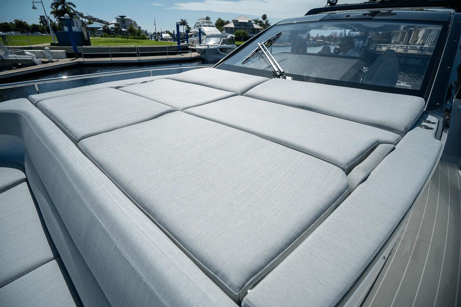 2026 Azimut Verve 42 yacht with spacious sunbathing deck in marina setting.