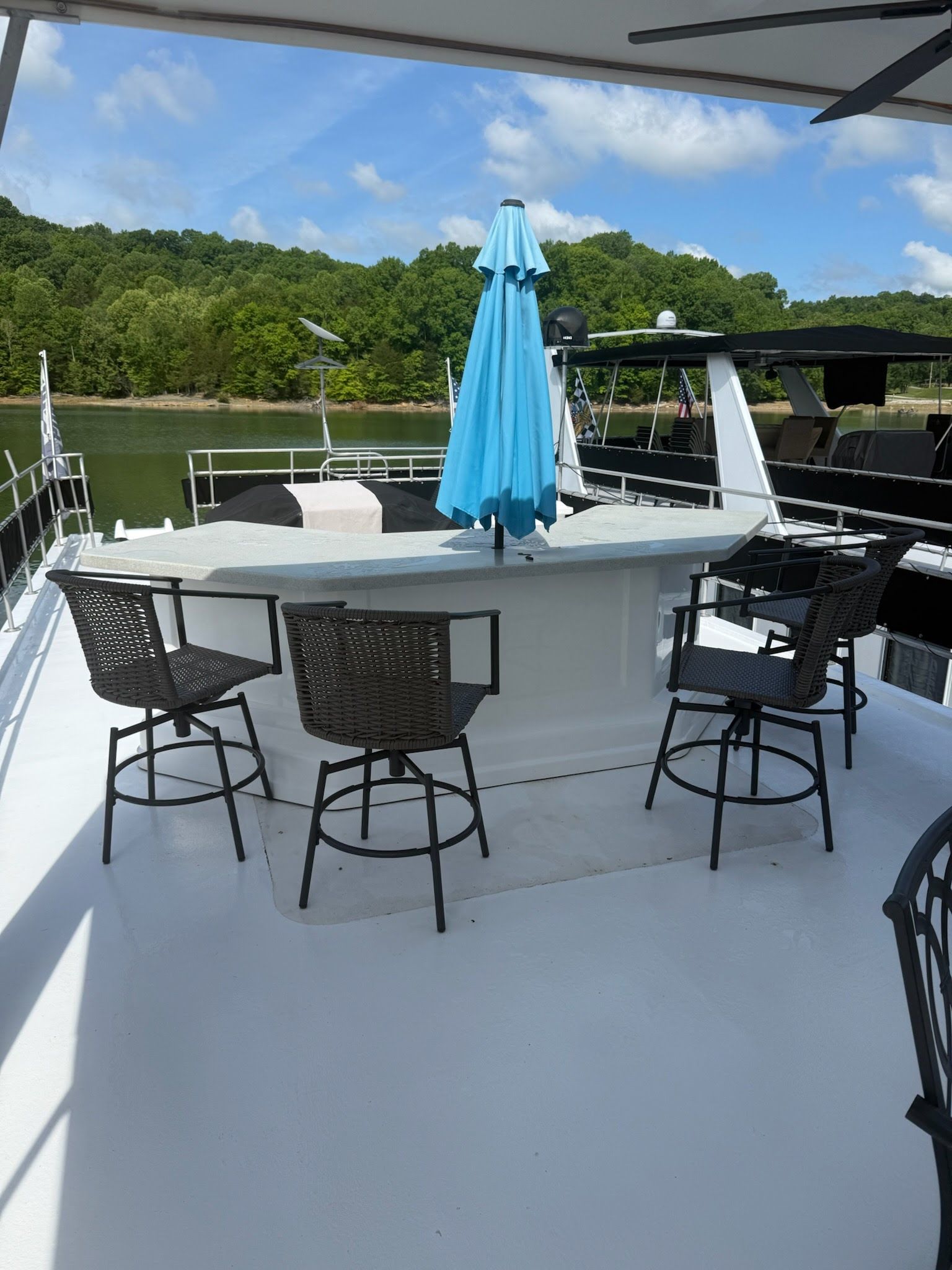 2003 Lakeview 16x70 houseboat with deck bar and chairs.