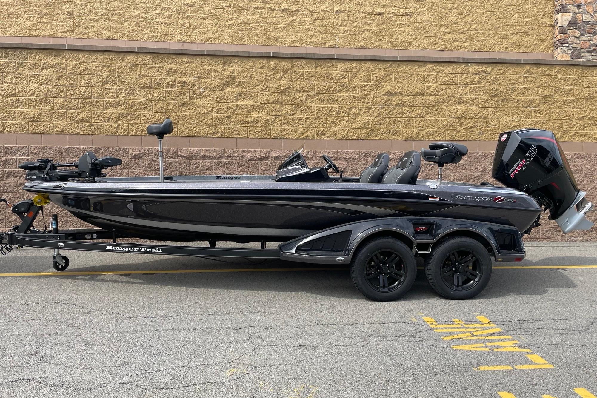 2026 Ranger Z520R bass boat on trailer, parked against a brick wall.