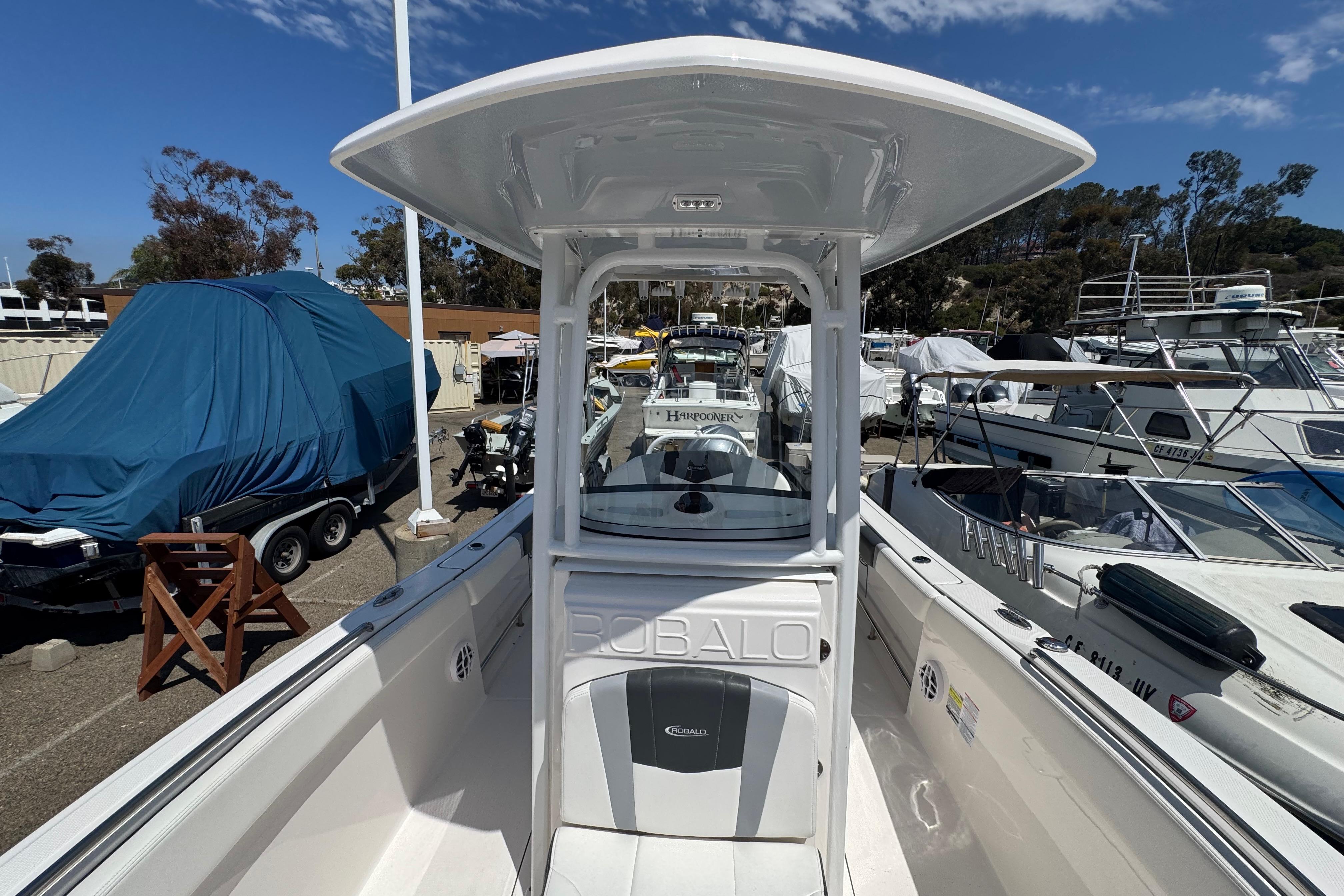 2022 Robalo R230 Center Console boat docked, showcasing sleek design and spacious deck.