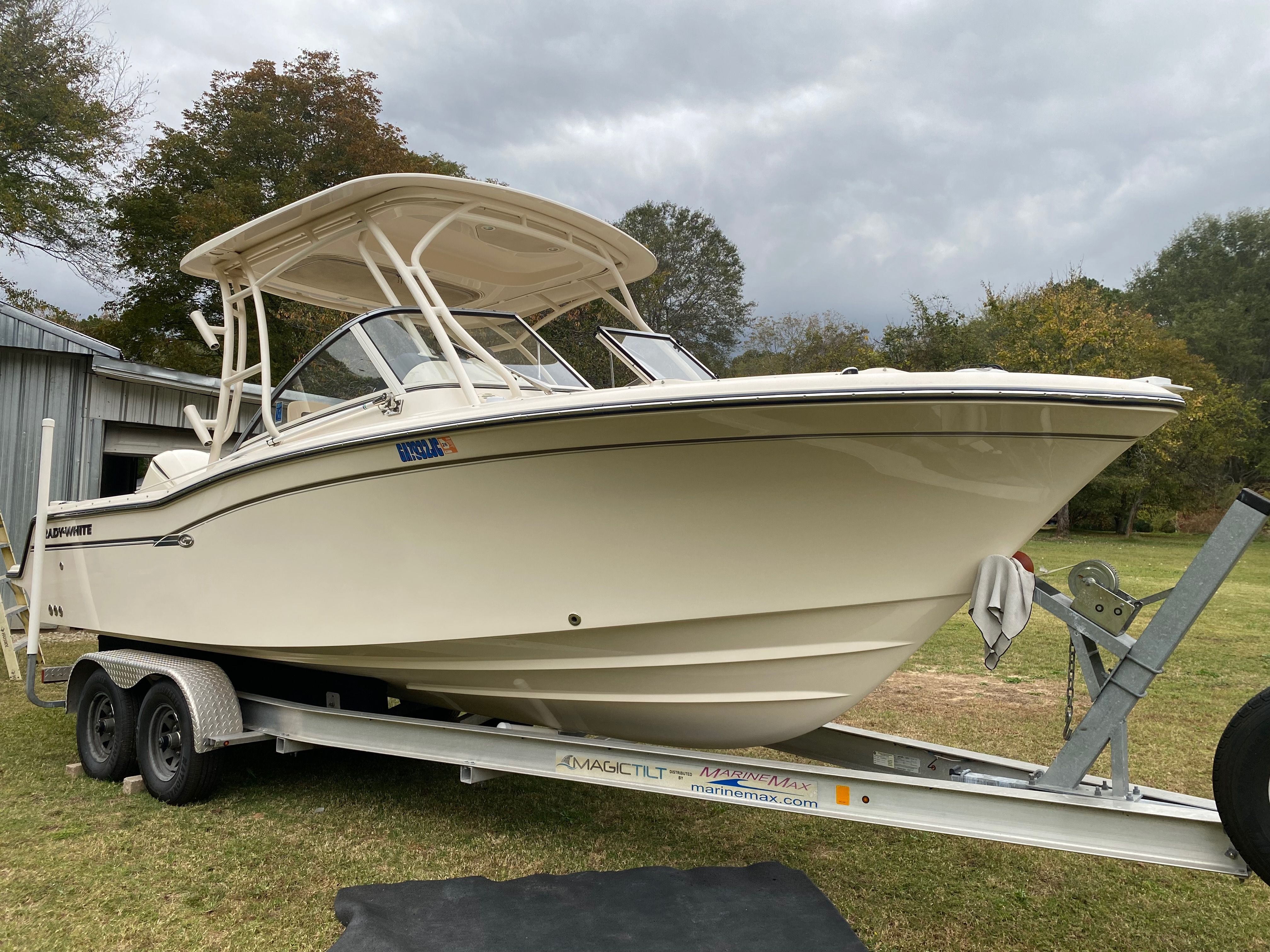 2018 Grady-White Freedom 235 boat on trailer outdoors.