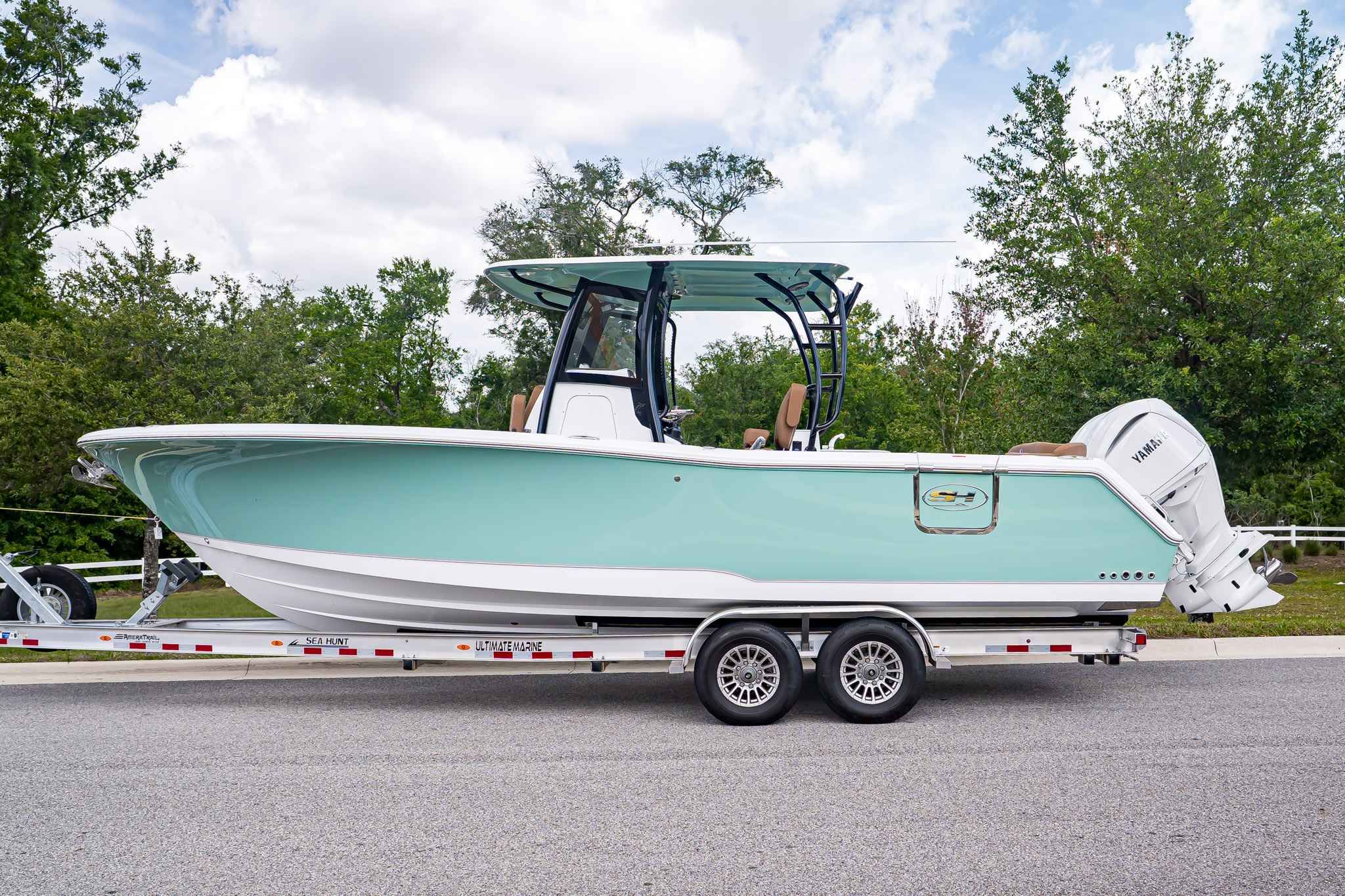 2026 Sea Hunt ULTRA 285CB boat on trailer, side view.