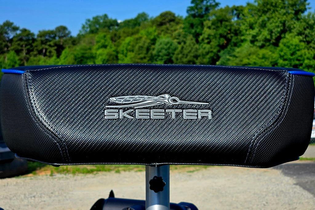 Skeeter ZXE20 2026 boat seat with logo, textured black material, outdoor setting.