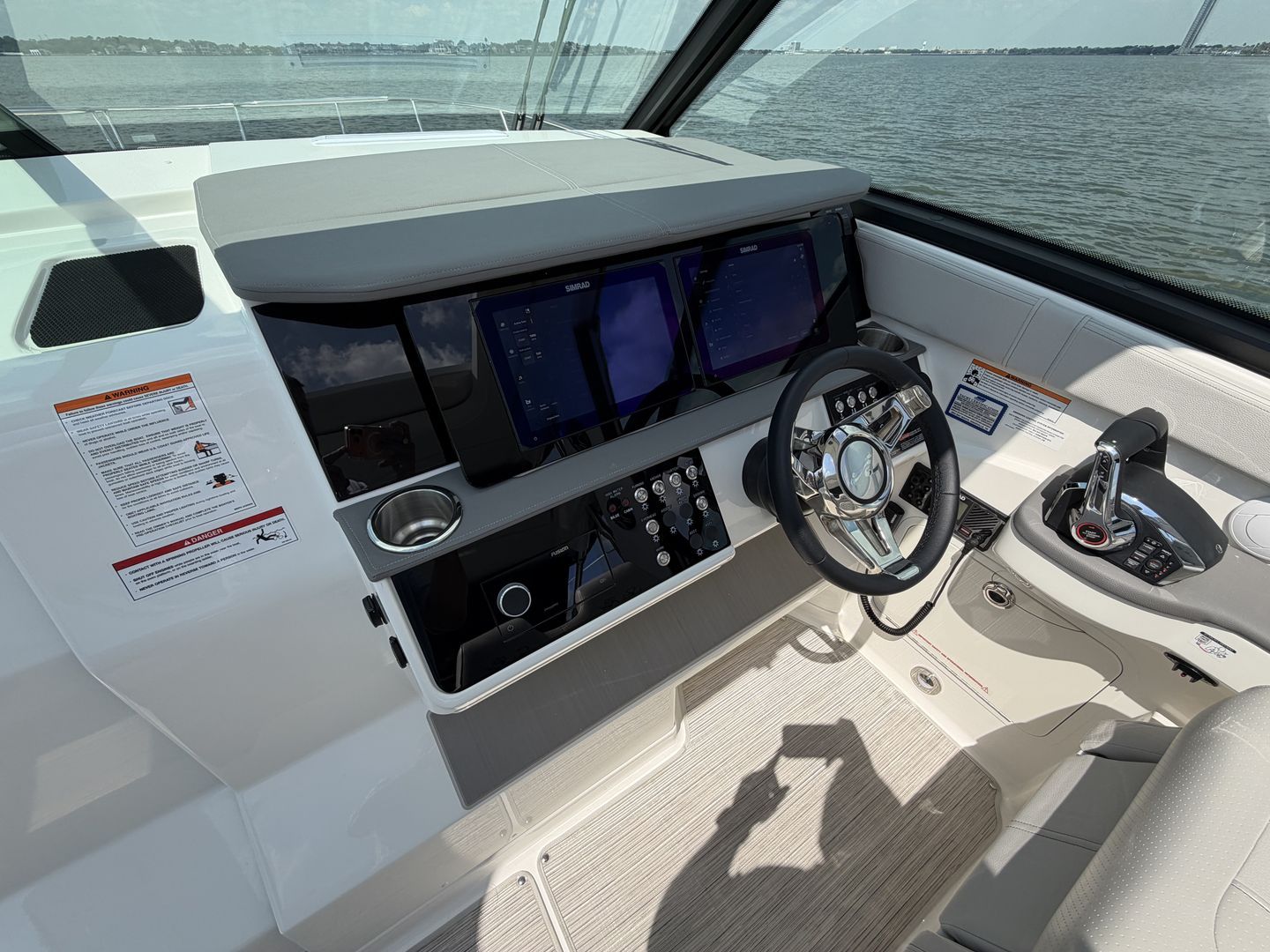 Cockpit of 2026 Sea Ray Sundancer 320 Outboard with modern controls.