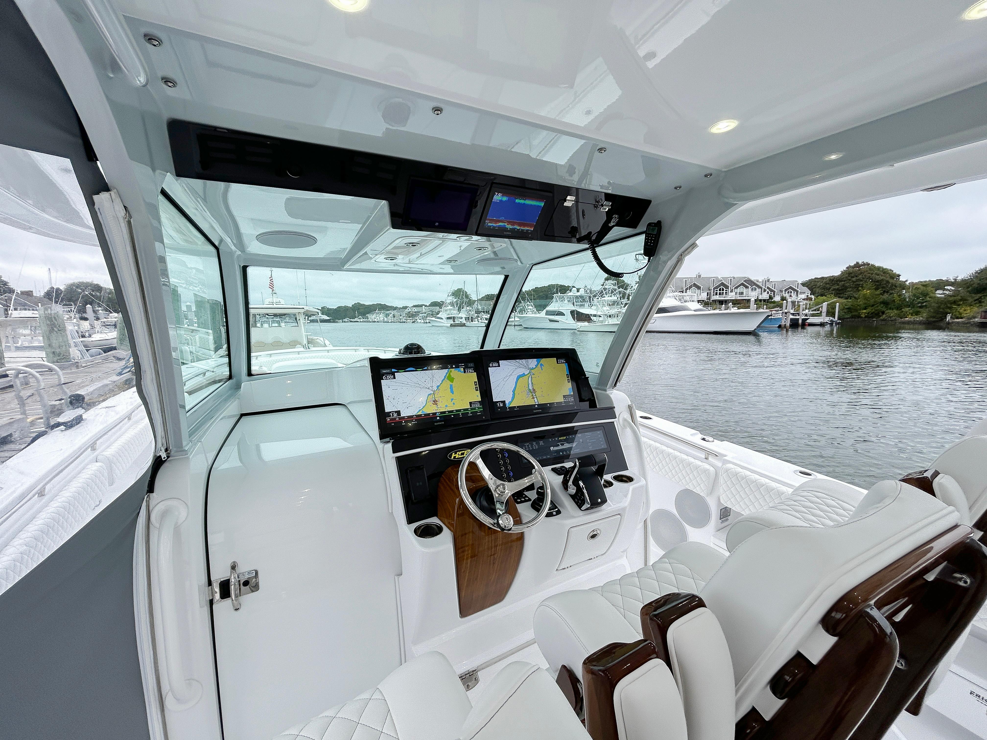 2025 HCB 48 Campeon boat cockpit with advanced navigation system and luxurious seating.