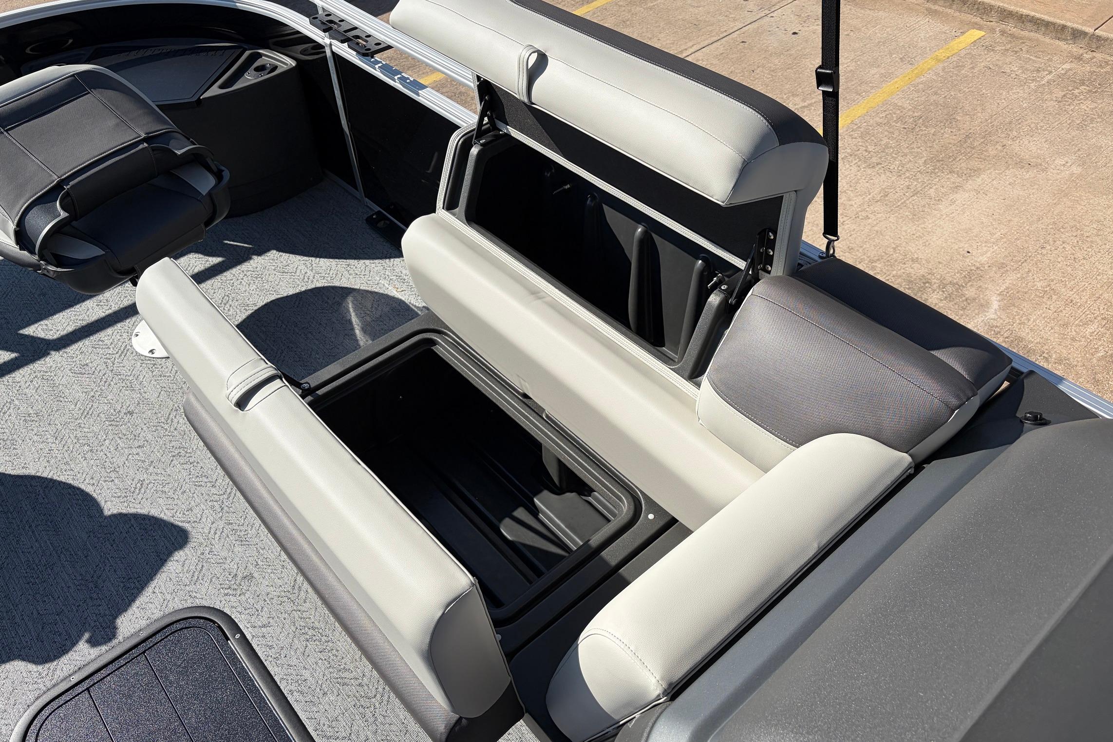 2026 Sun Tracker Fishin' Barge 22 XP3 interior with open storage compartments.