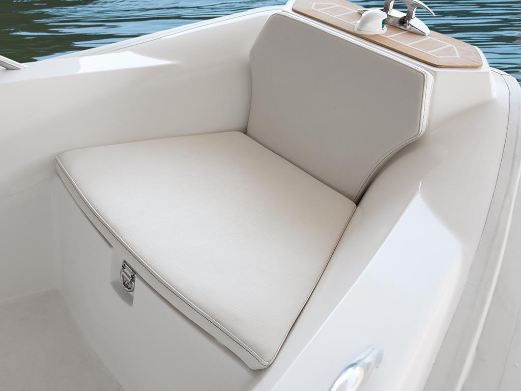 Comfortable seating on a 2014 Capelli 460 boat, featuring white cushions and sleek design.
