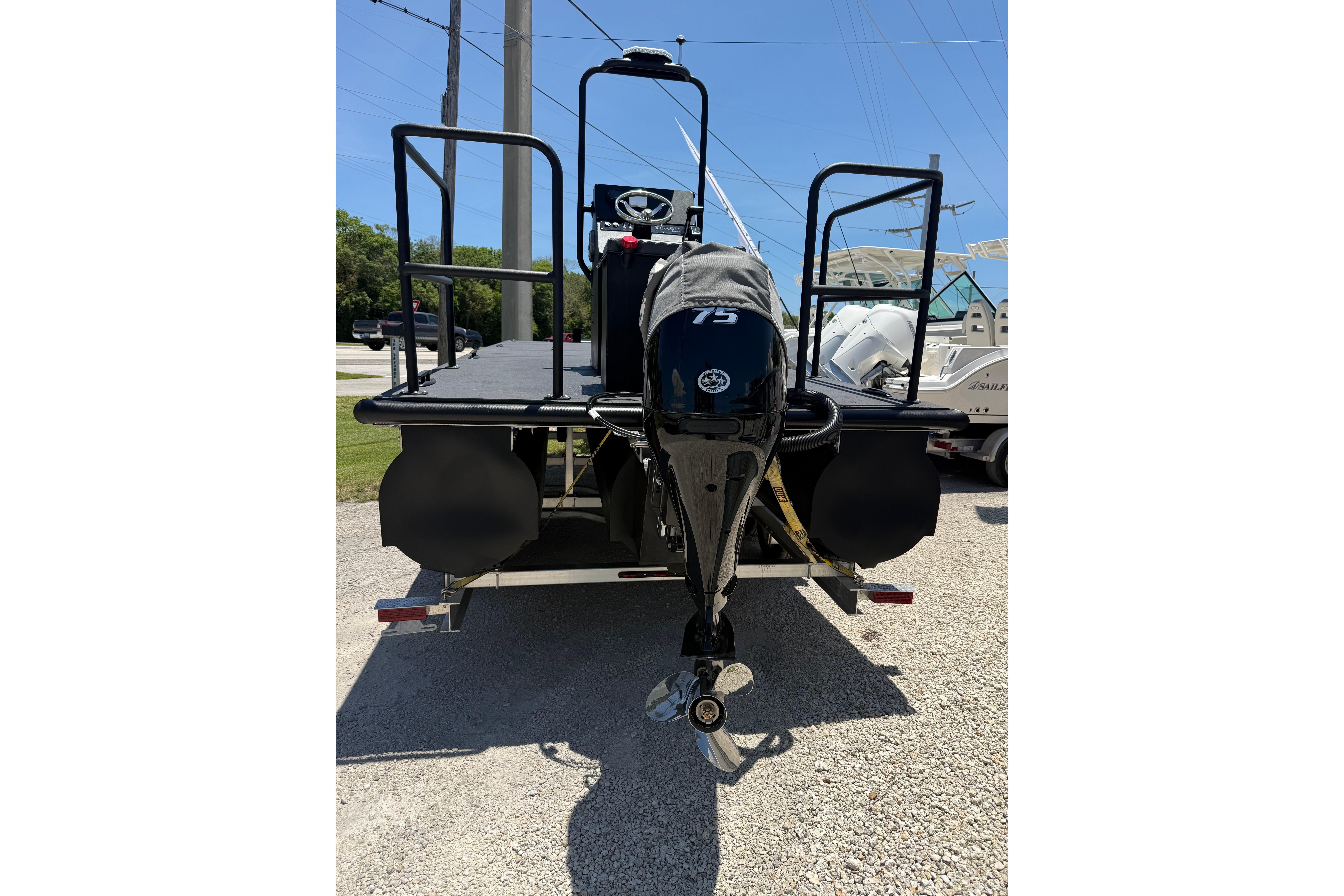 Tough 20 boat, 2026 model, with 75 HP outboard motor on trailer.