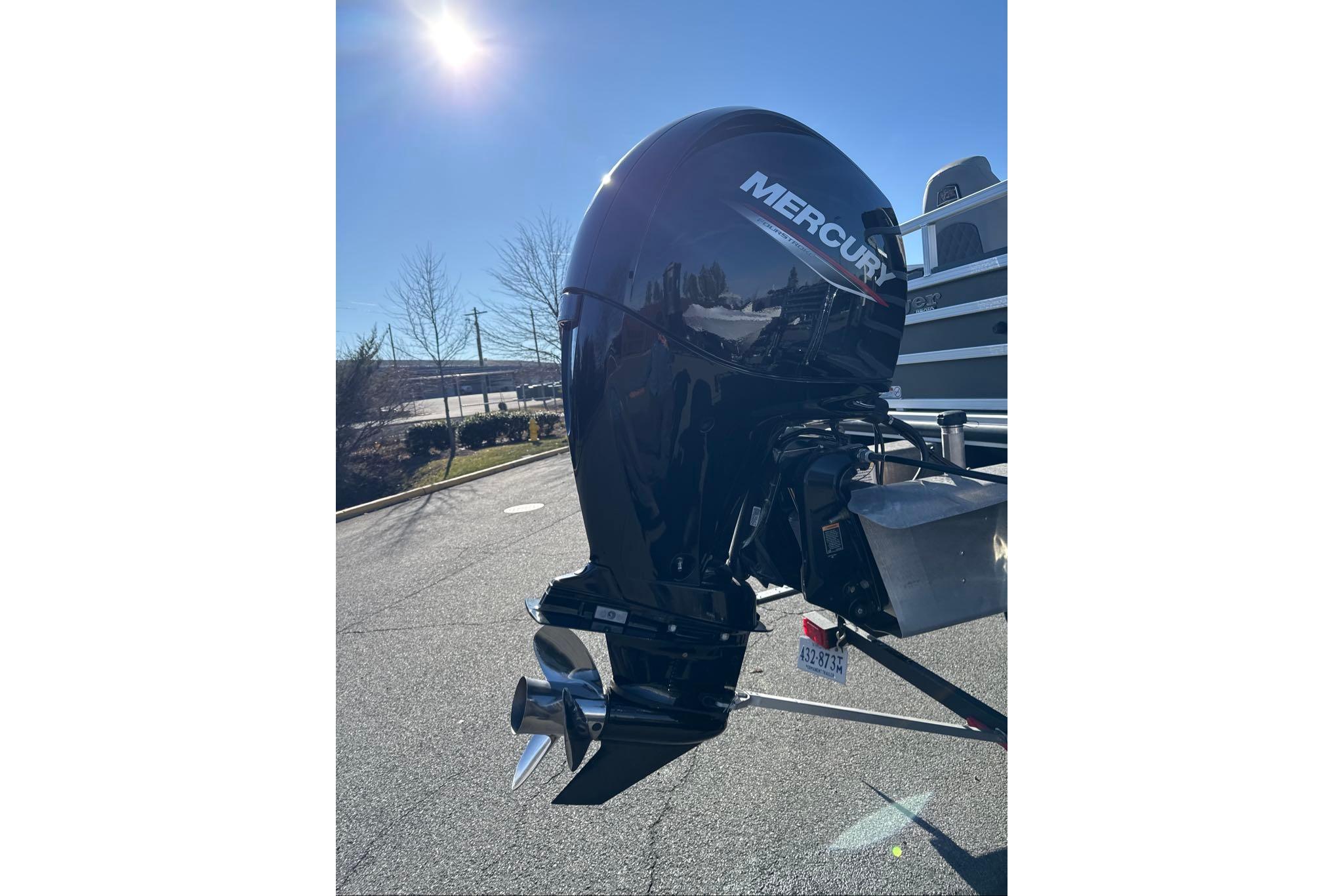 2024 Ranger Reata 220F boat with Mercury outboard motor in sunlight.