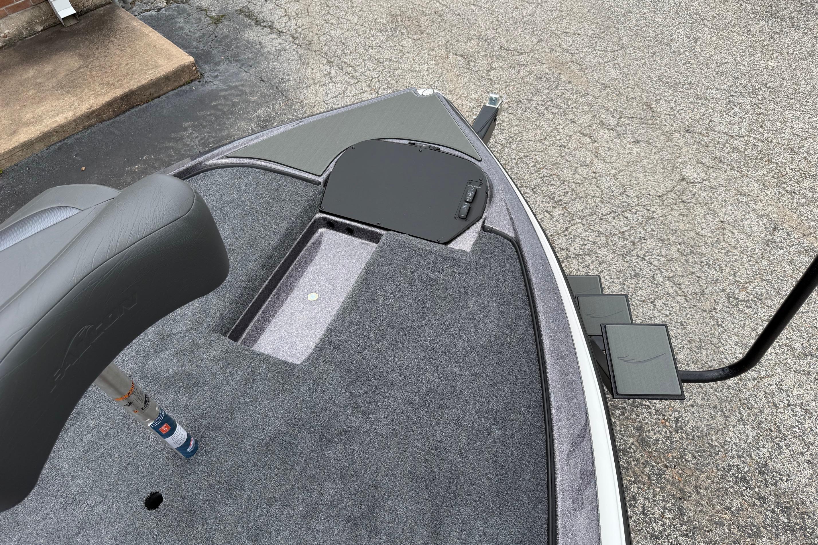 2027 Falcon Boats F215 deck with seating and storage compartments.