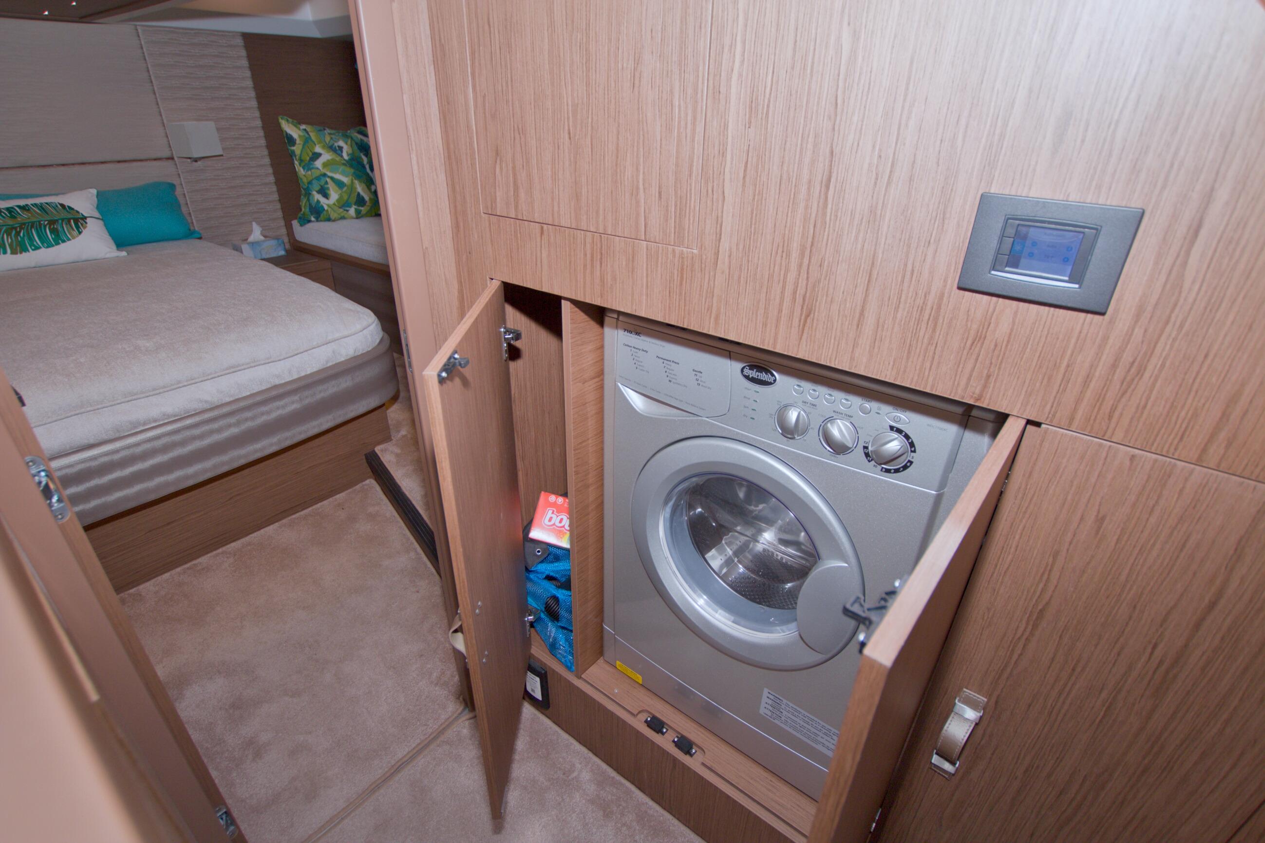 2019 Beneteau Gran Turismo 50 interior with washing machine and cozy bedroom.